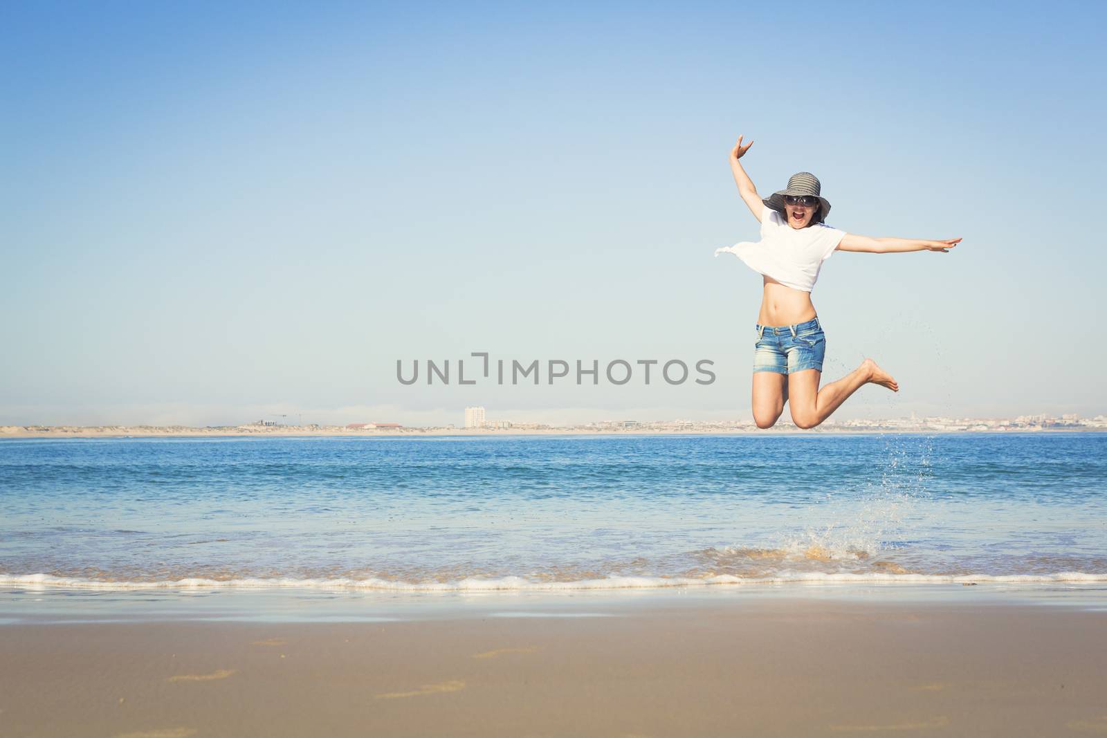 Beautiful young woman enjoying the beach 