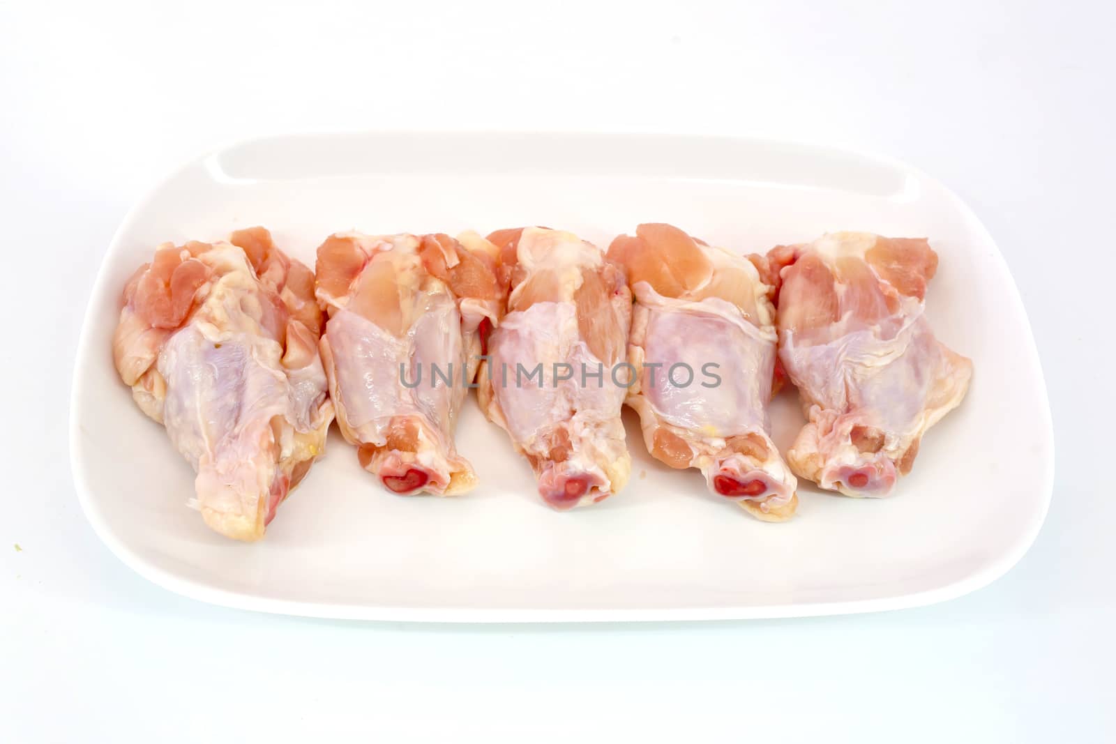 Fresh raw chicken wings isolate on white background ready to be grilled