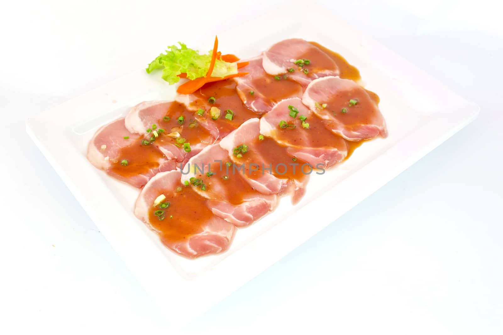 freshness slided pork on white dish for grill