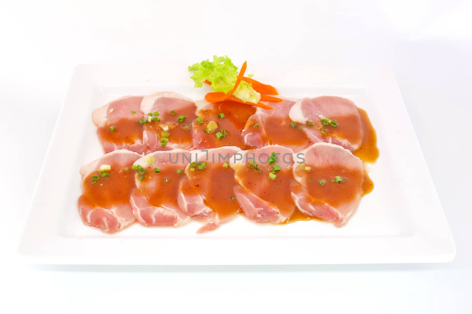 freshness slided pork on white dish for grill