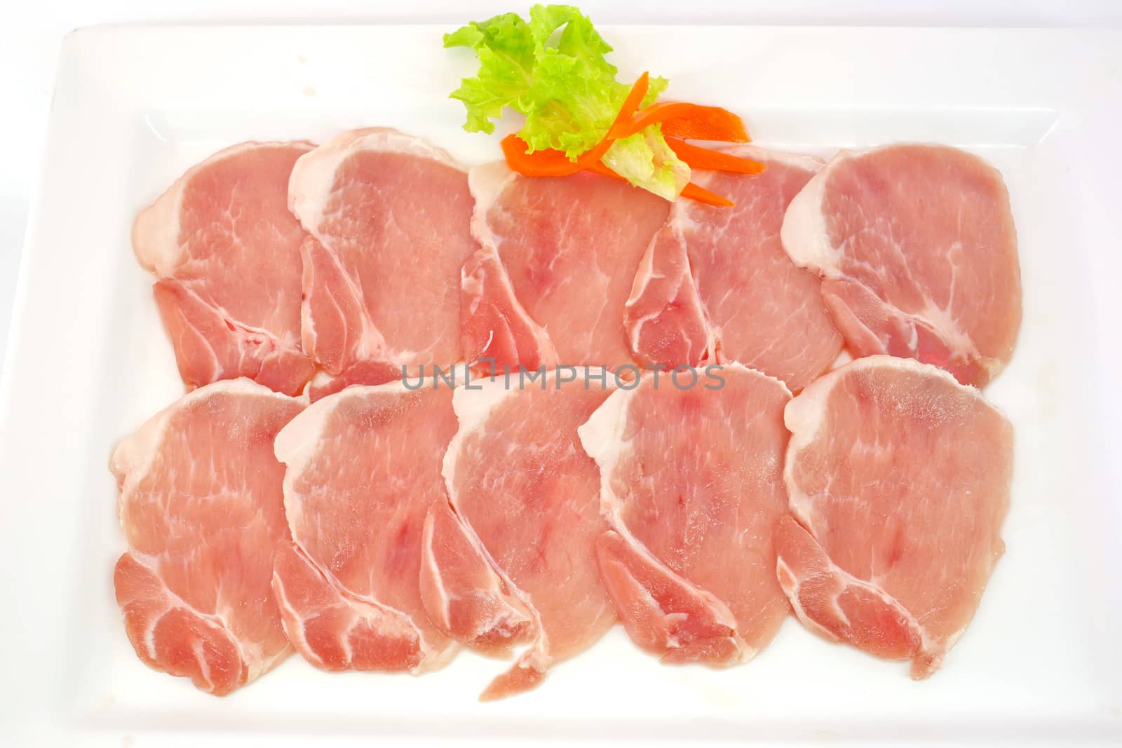 freshness slided pork on white dish for grill