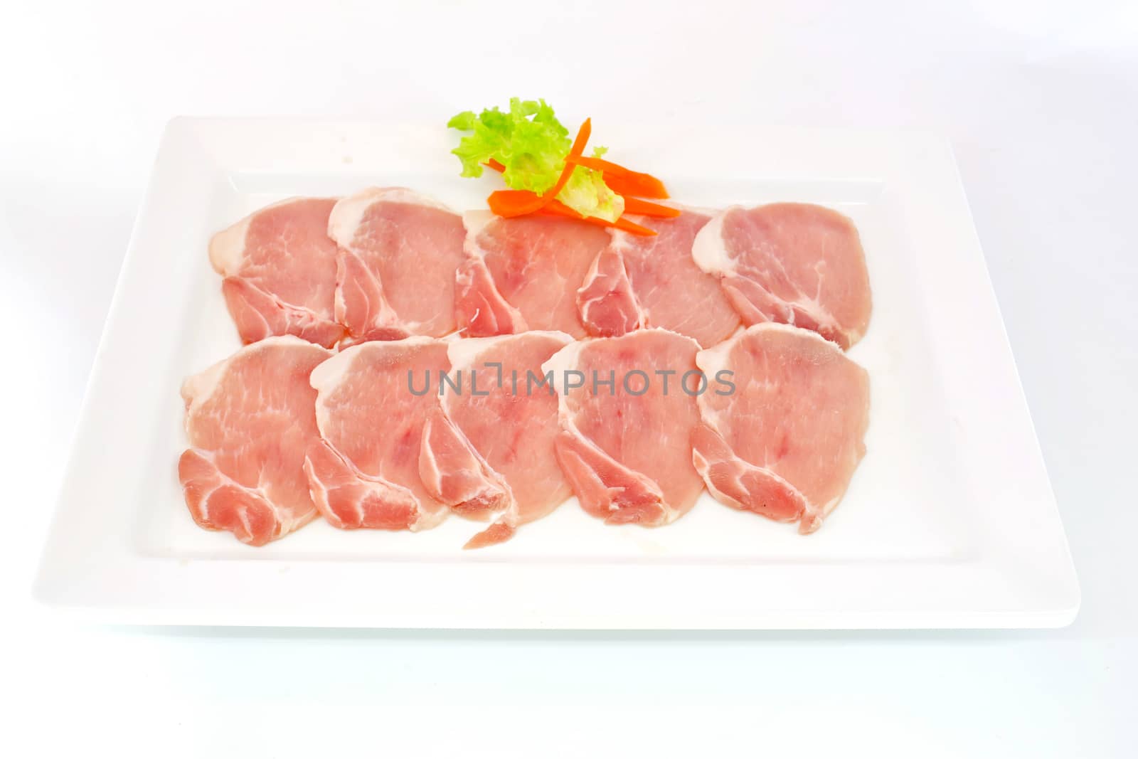 freshness slided pork on white dish for grill