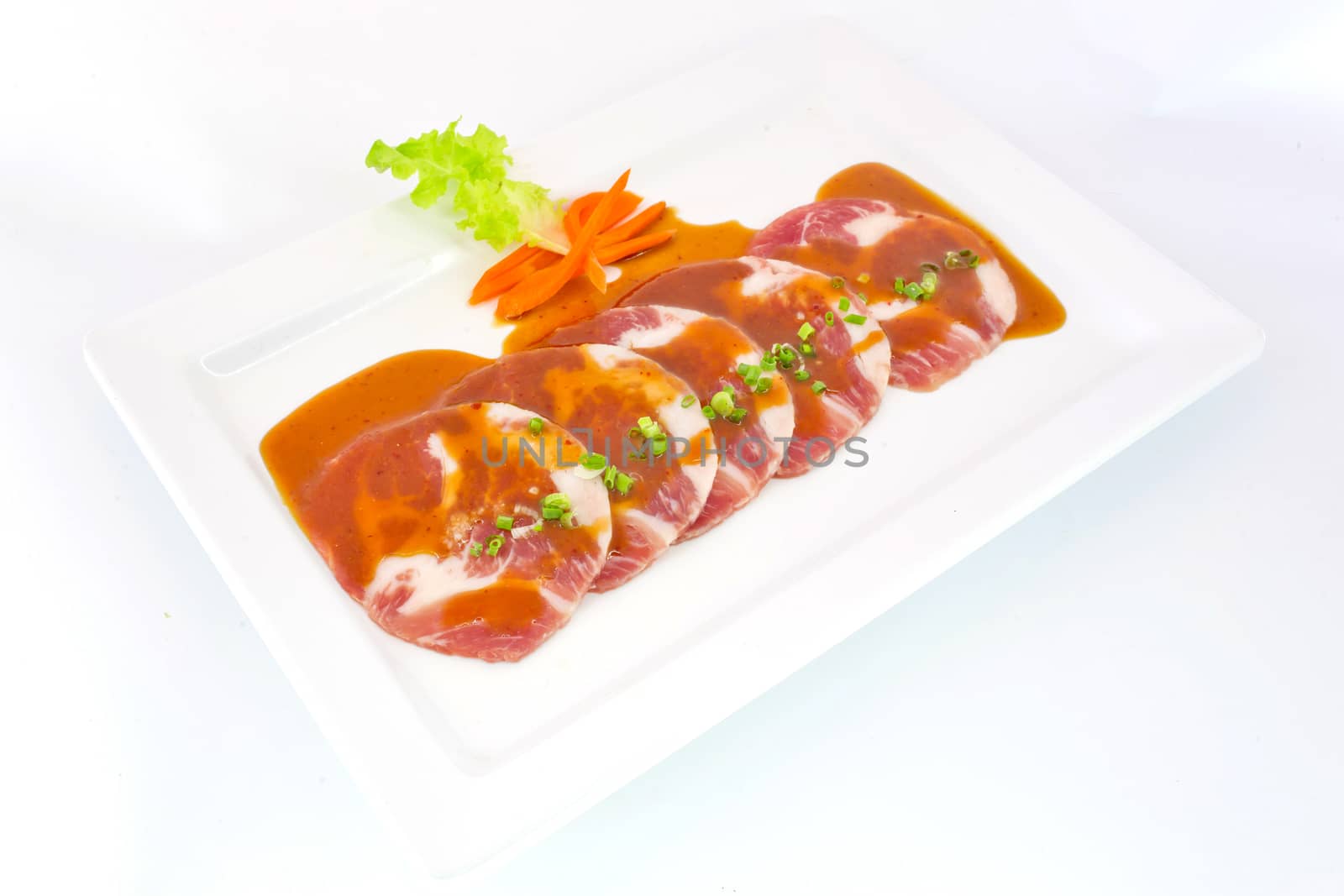 freshness slided pork on white dish for grill