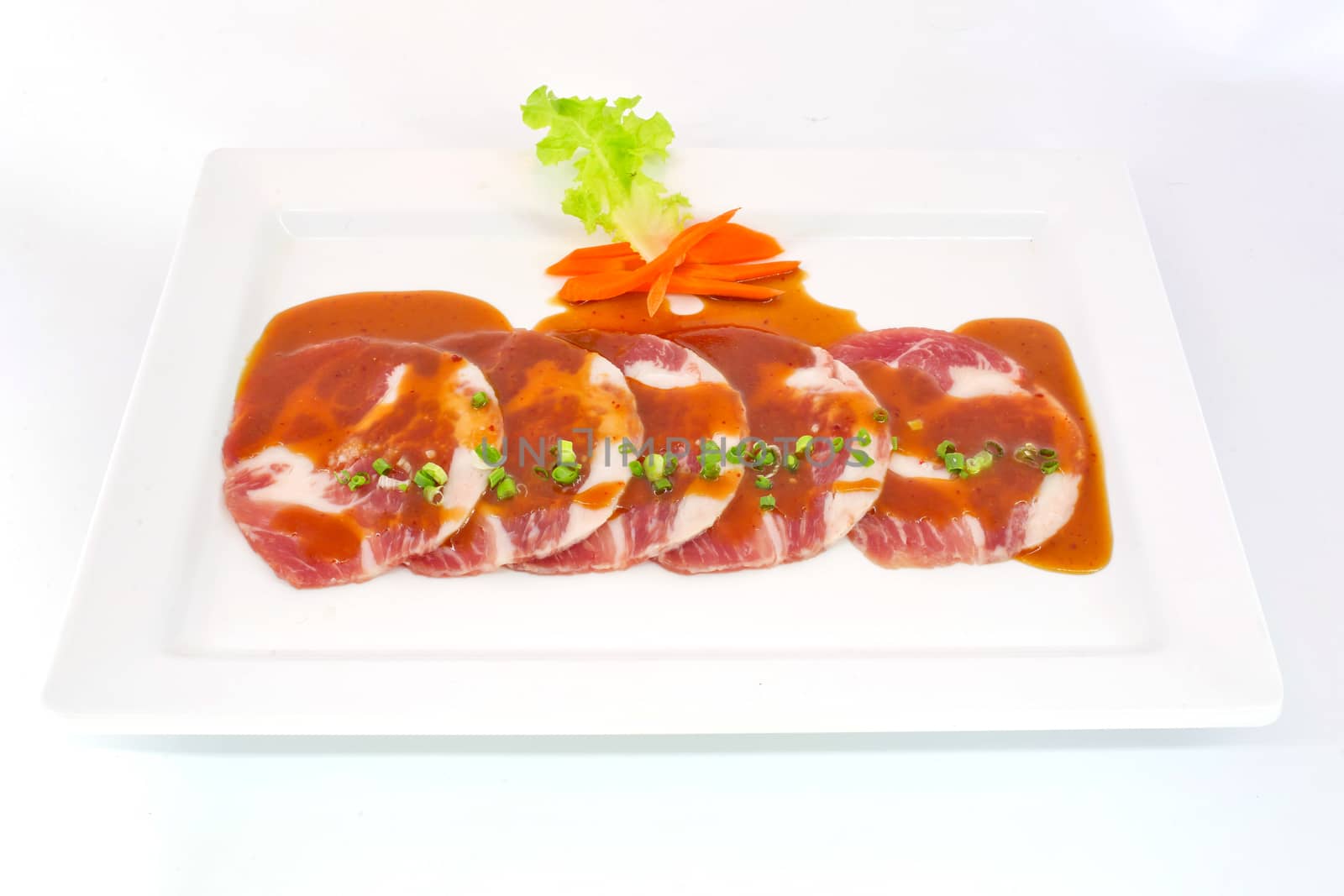 freshness slided pork on white dish for grill