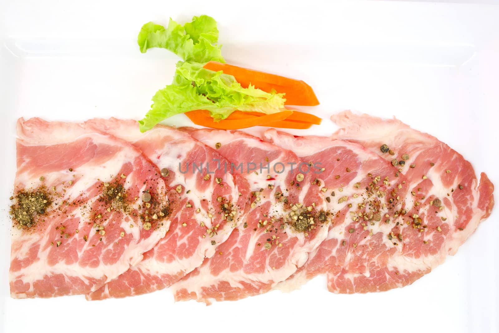 freshness slided pork on white dish for grill