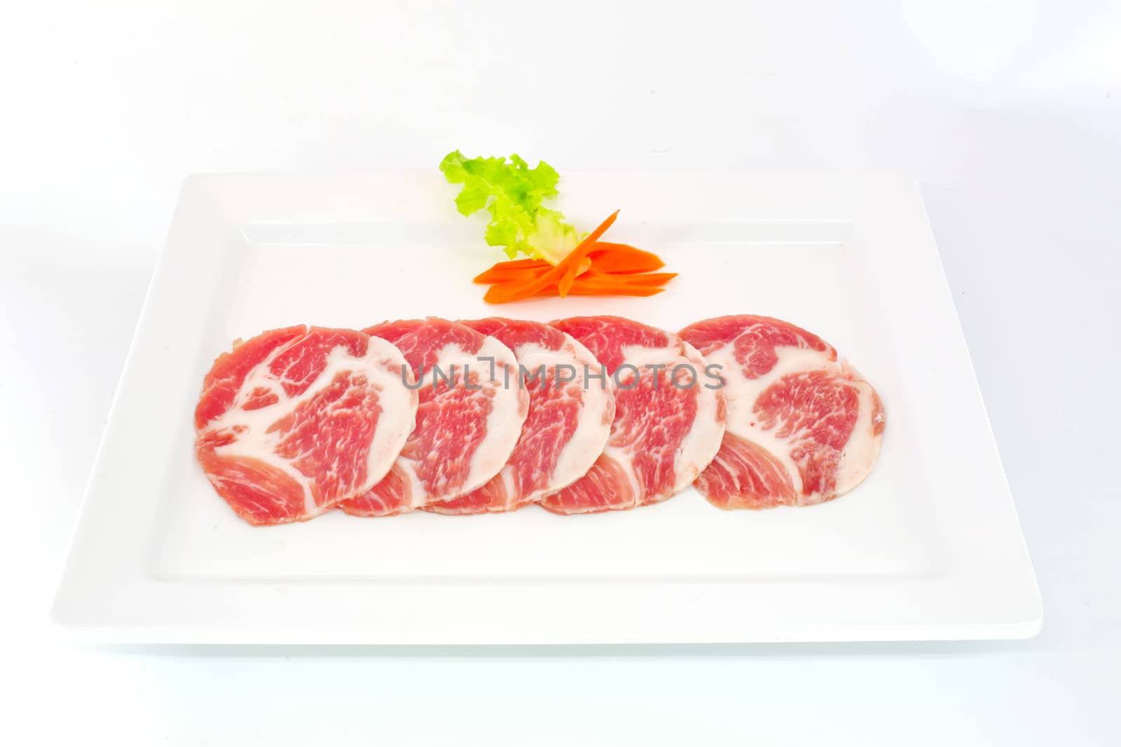 freshness slided pork on white dish for grill