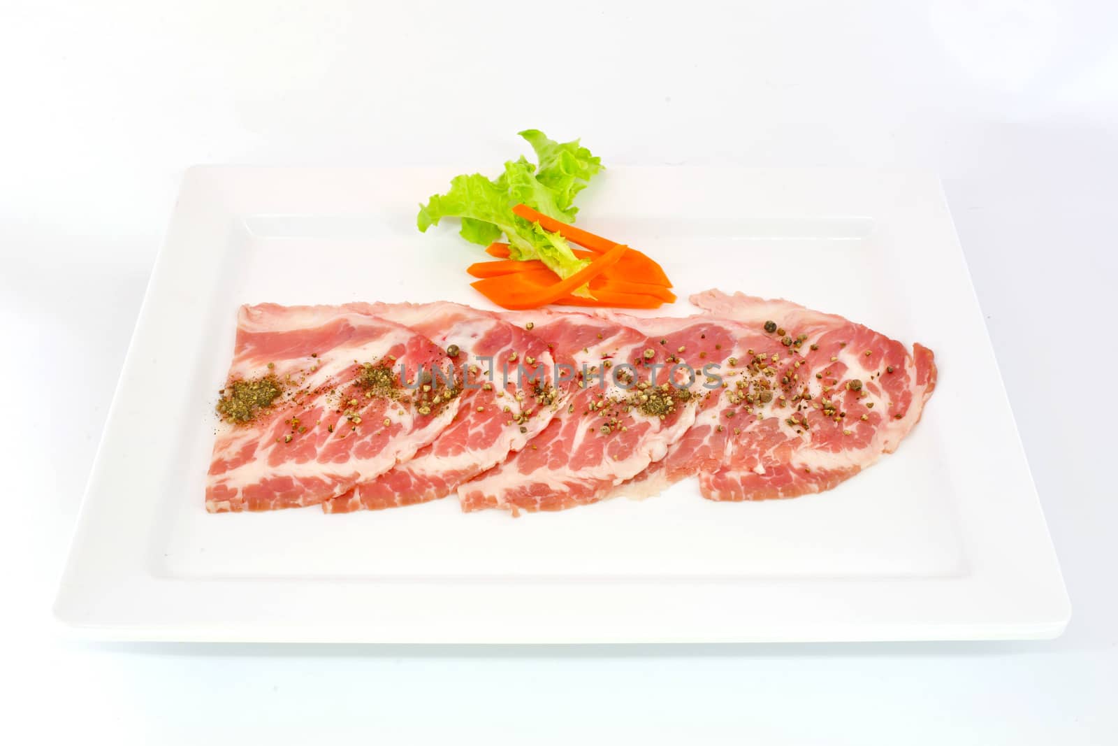 freshness slided pork on white dish for grill