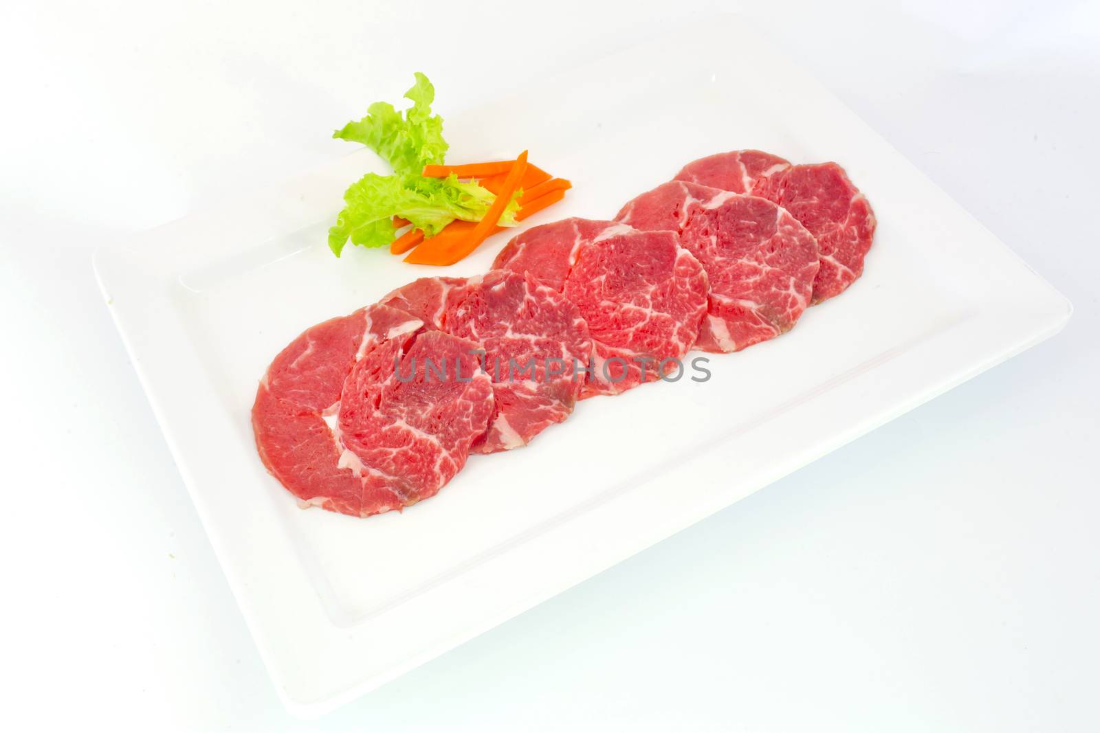 High grade sliced Hida wagyu beef isolated on white background