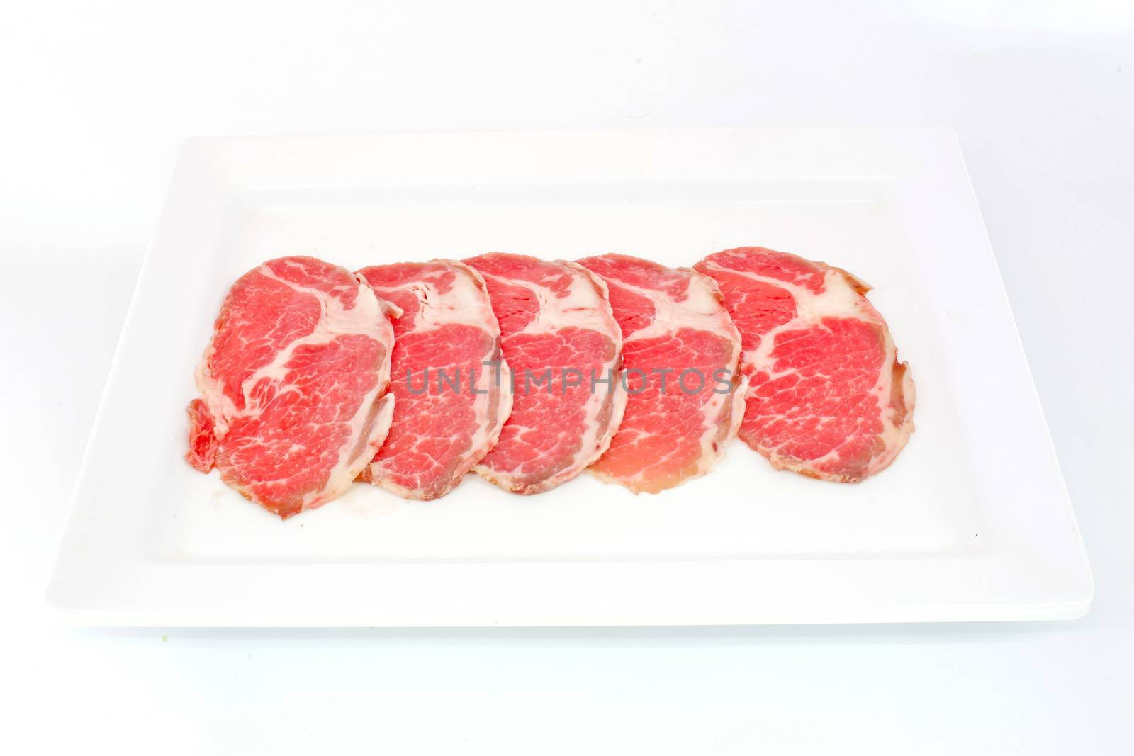 High grade sliced Hida wagyu beef isolated on white background