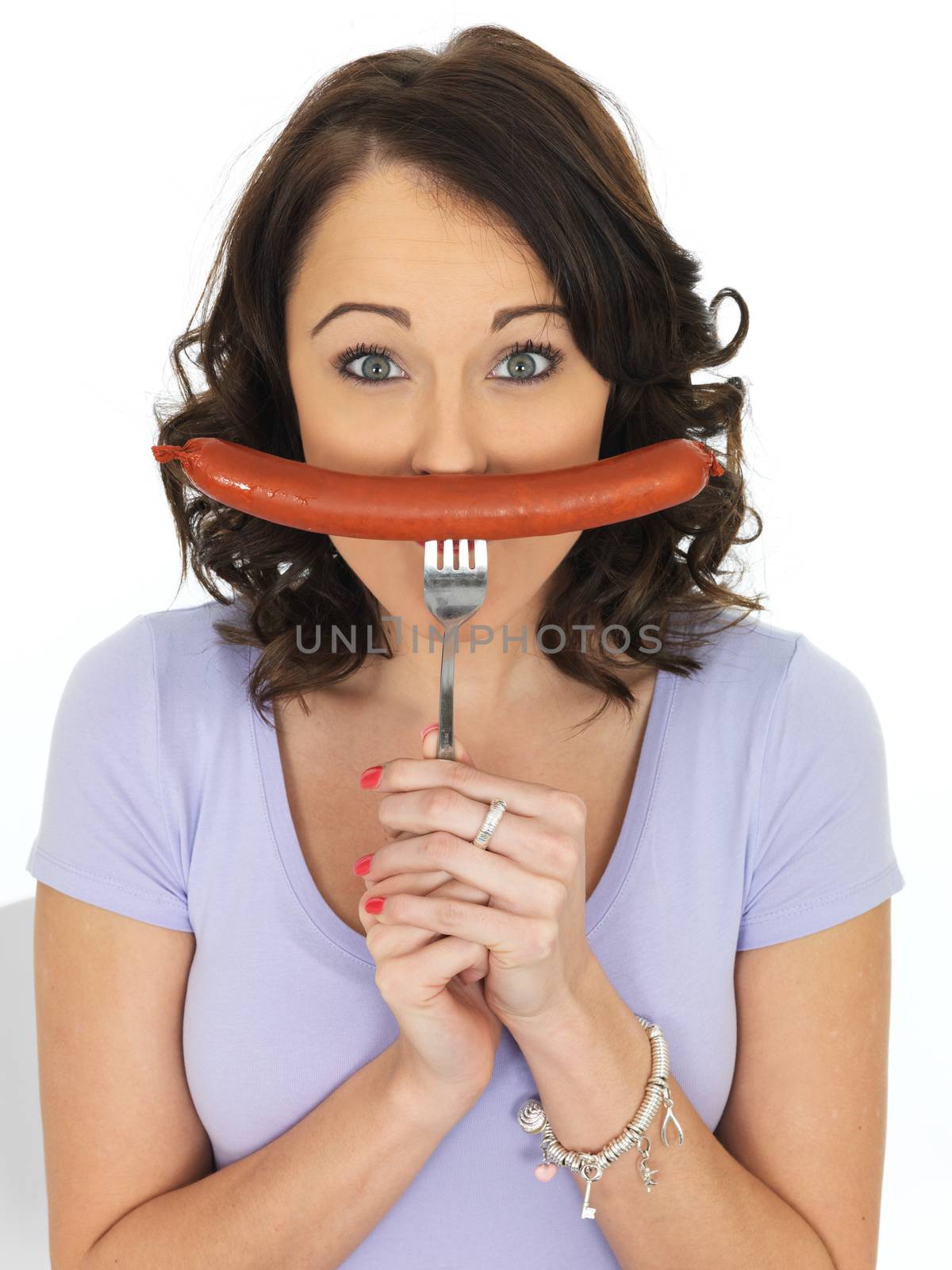 Young Attractive Woman Holding a Saveloy Sausage
