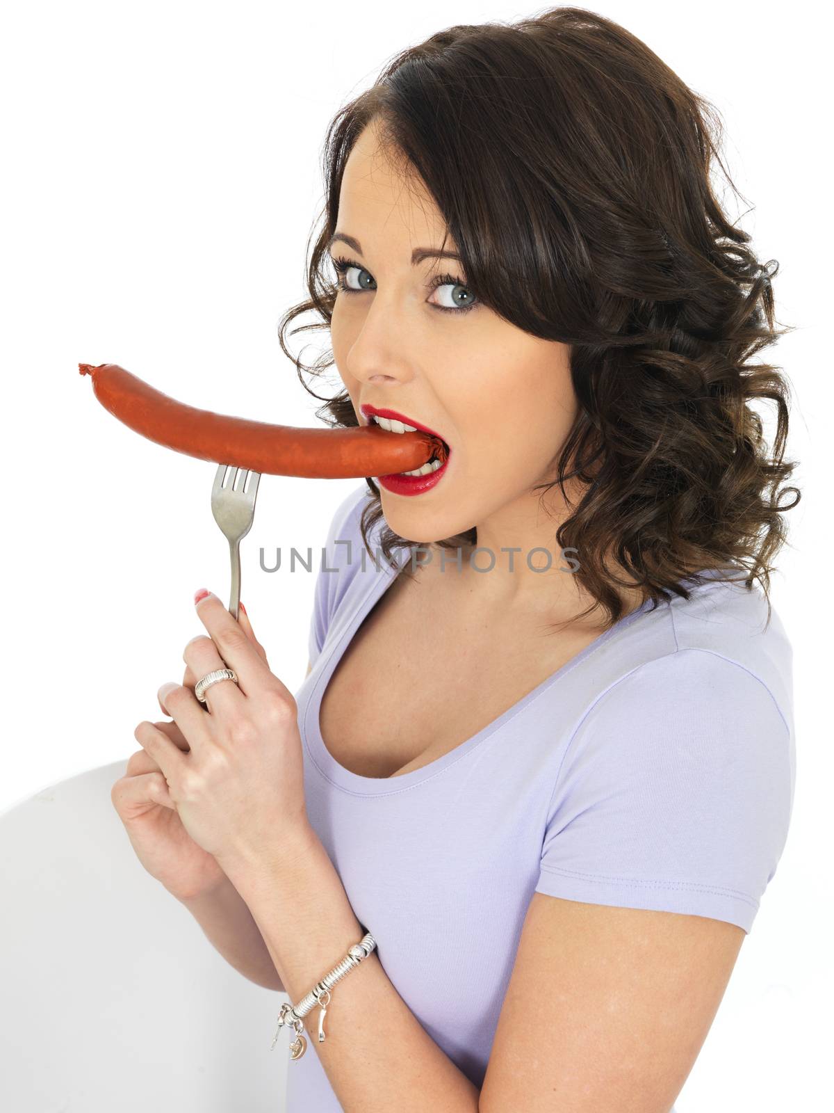 Young Attractive Woman Holding a Saveloy Sausage
