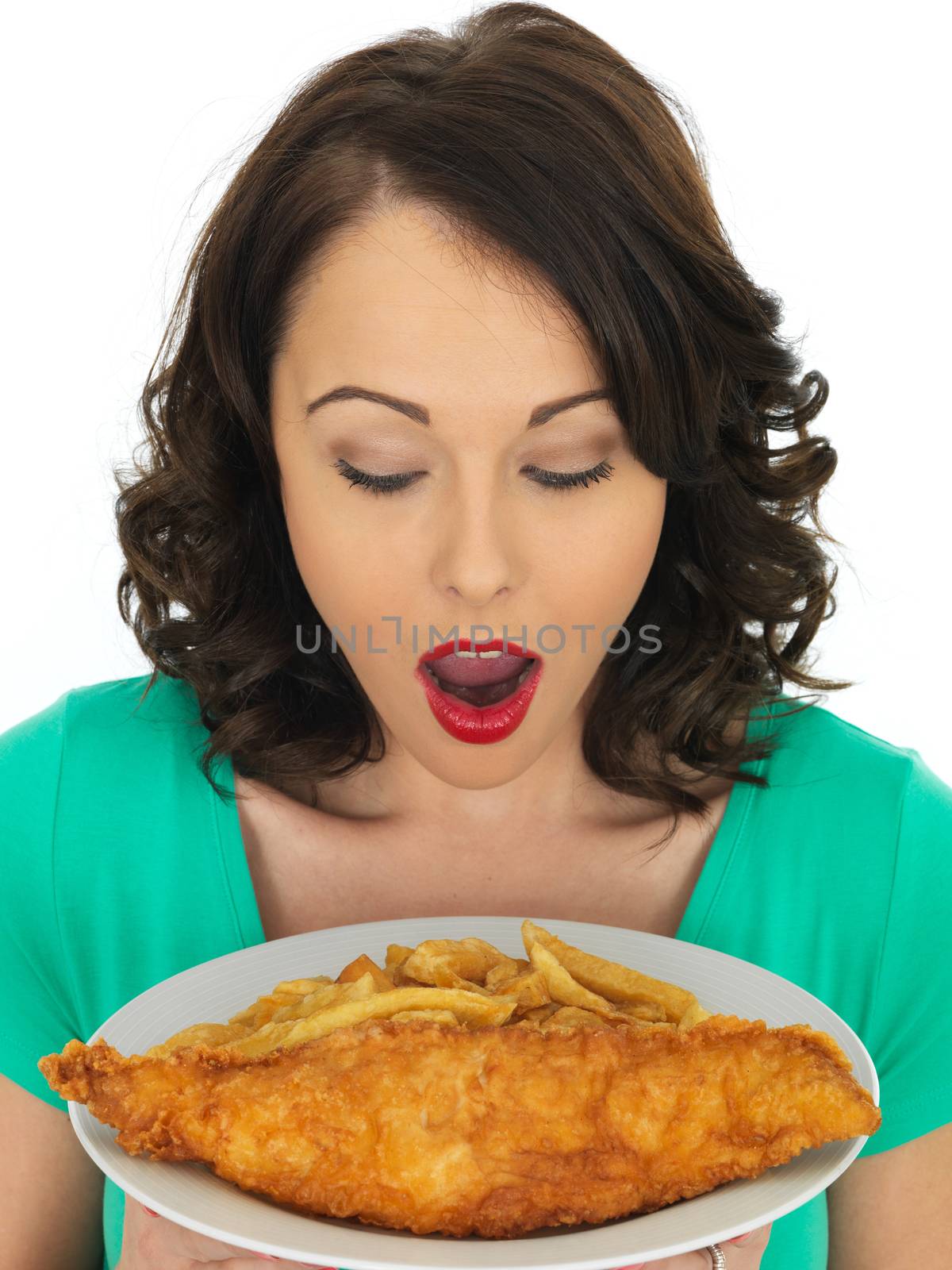 Young Woman Eating Traditional Fish and Chips by Whiteboxmedia