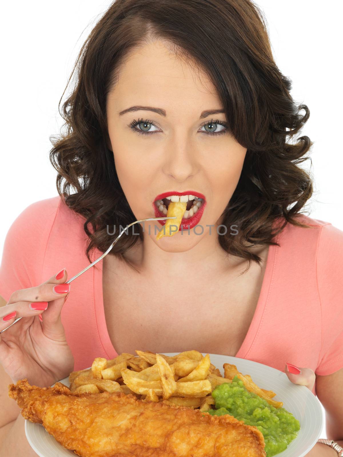Young Woman Eating Fish and Chips with Mushy Peas by Whiteboxmedia
