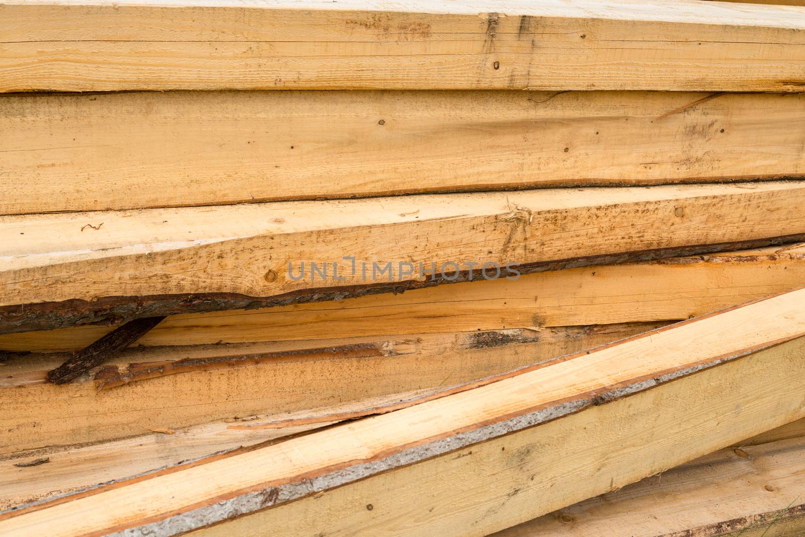 Pile of wooden beams by rootstocks