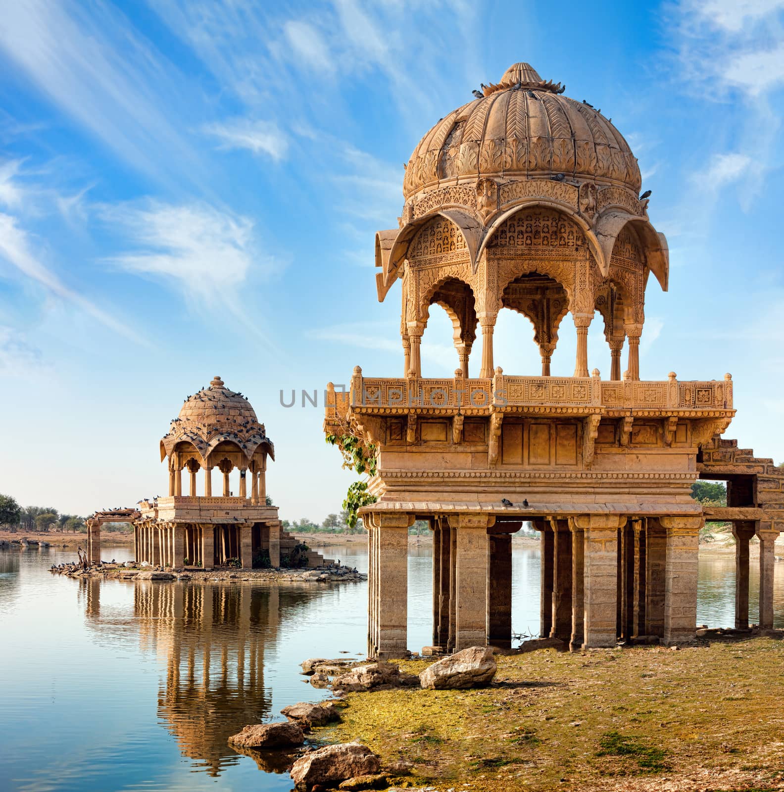 Gadi Sagar (Gadisar) Lake is one of the most important tourist attractions in Jaisalmer, Rajasthan, North India.   	
Artistically carved temples and shrines around The Lake Gadisar Jaisalmer.