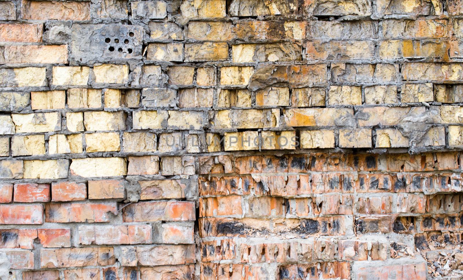 The old brick wall with rich texture.