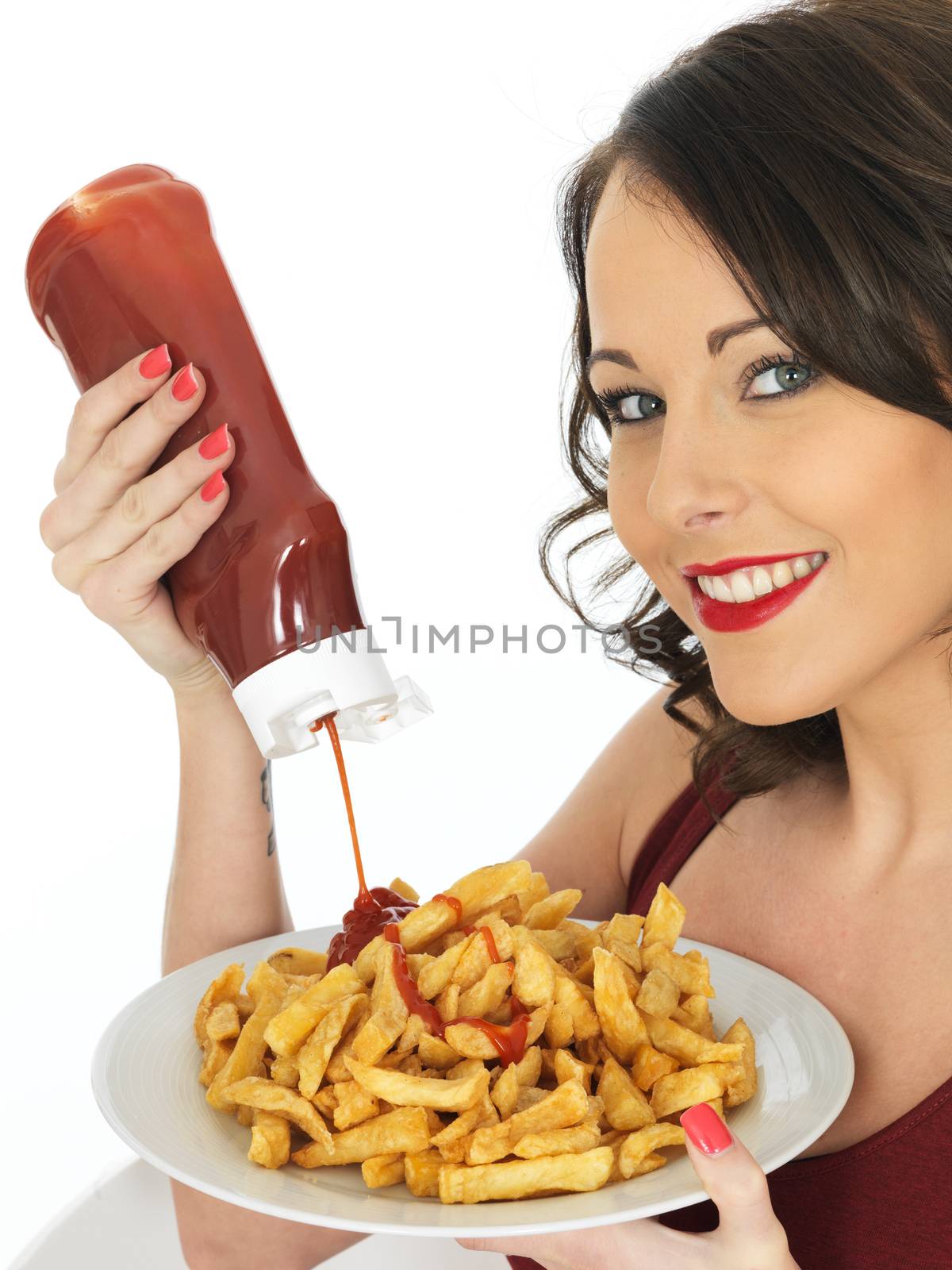 Young Woman Eating a Large Plate of Fried Chips by Whiteboxmedia