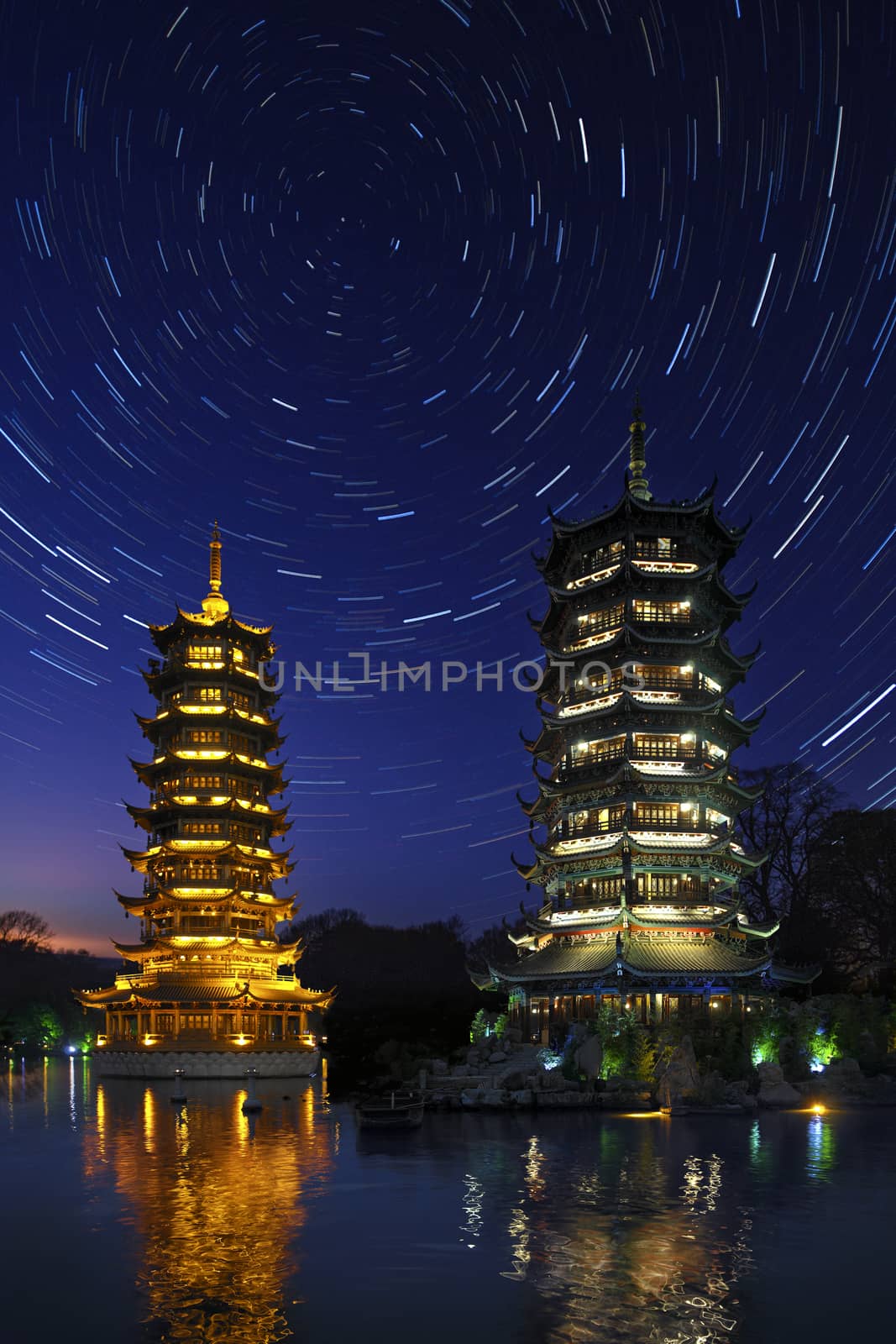 Astronomy - Star Trails over the twin pagodas of Fir Lake in the city of Guilin in the Guangxi Zhuang region of China.