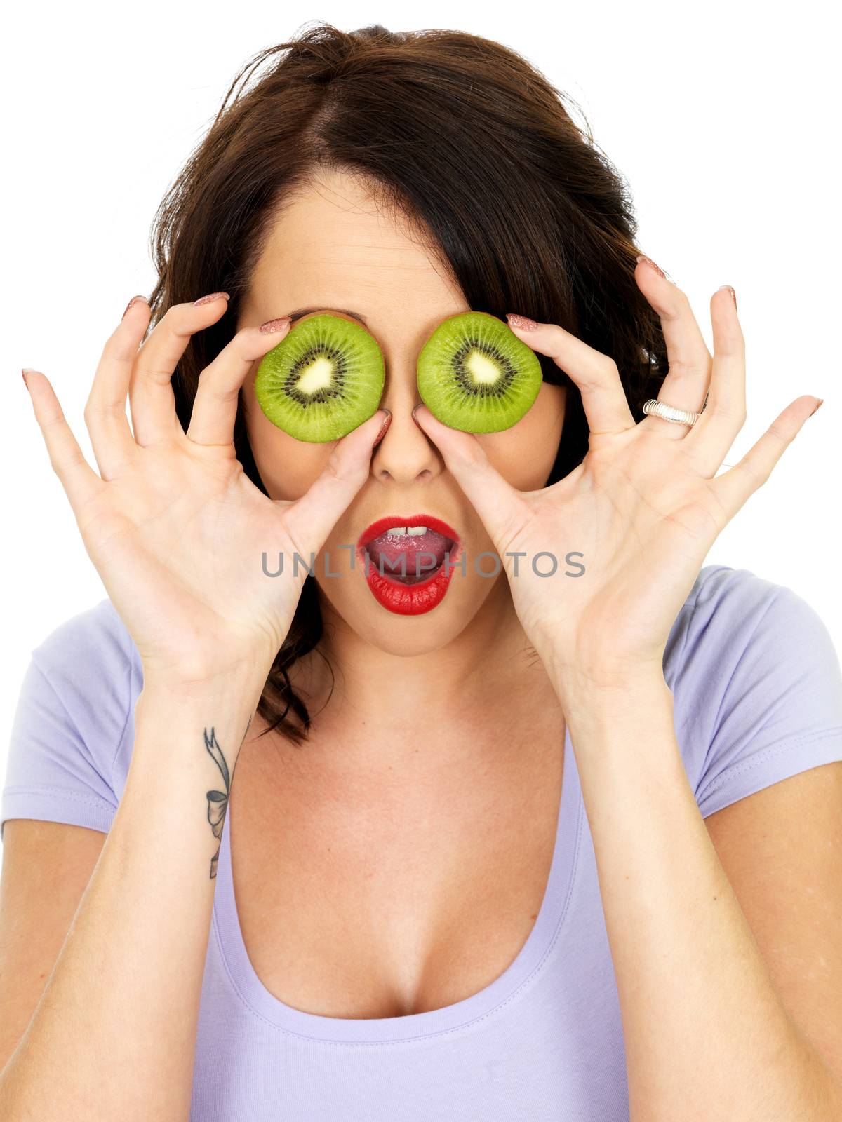 Shocked Surprised Young Woman Covering Eyes with Kiwi Fruit