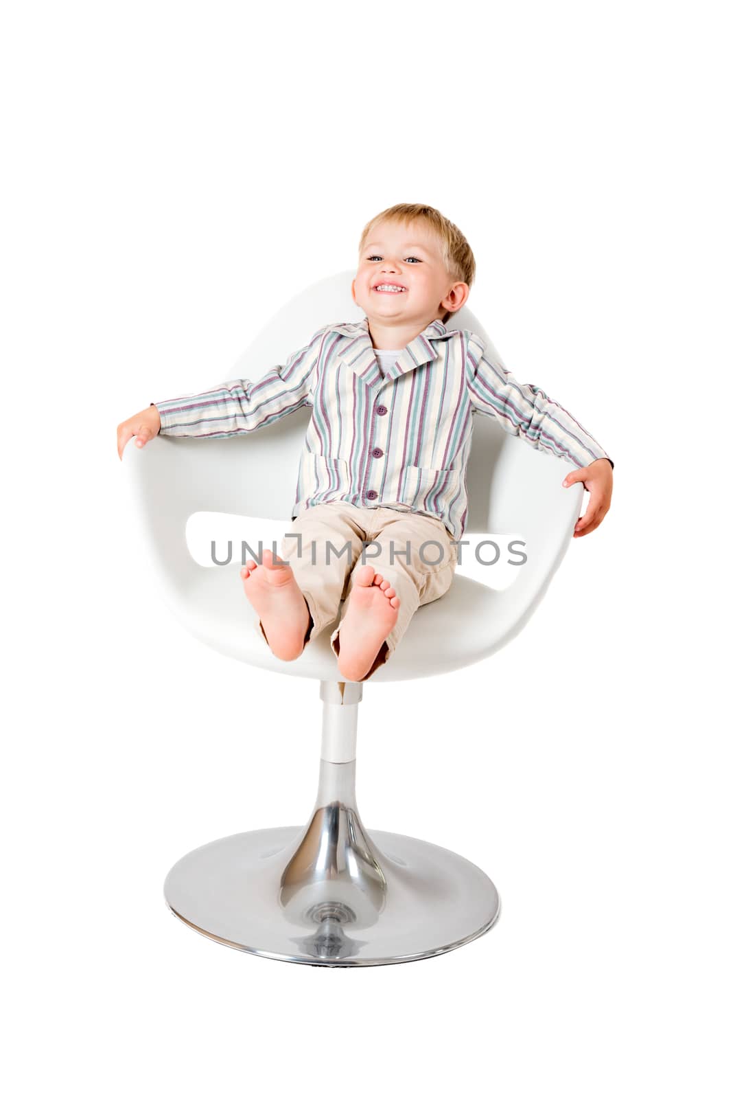 Boy shot in the studio on a white background in chair smiling by Nanisimova