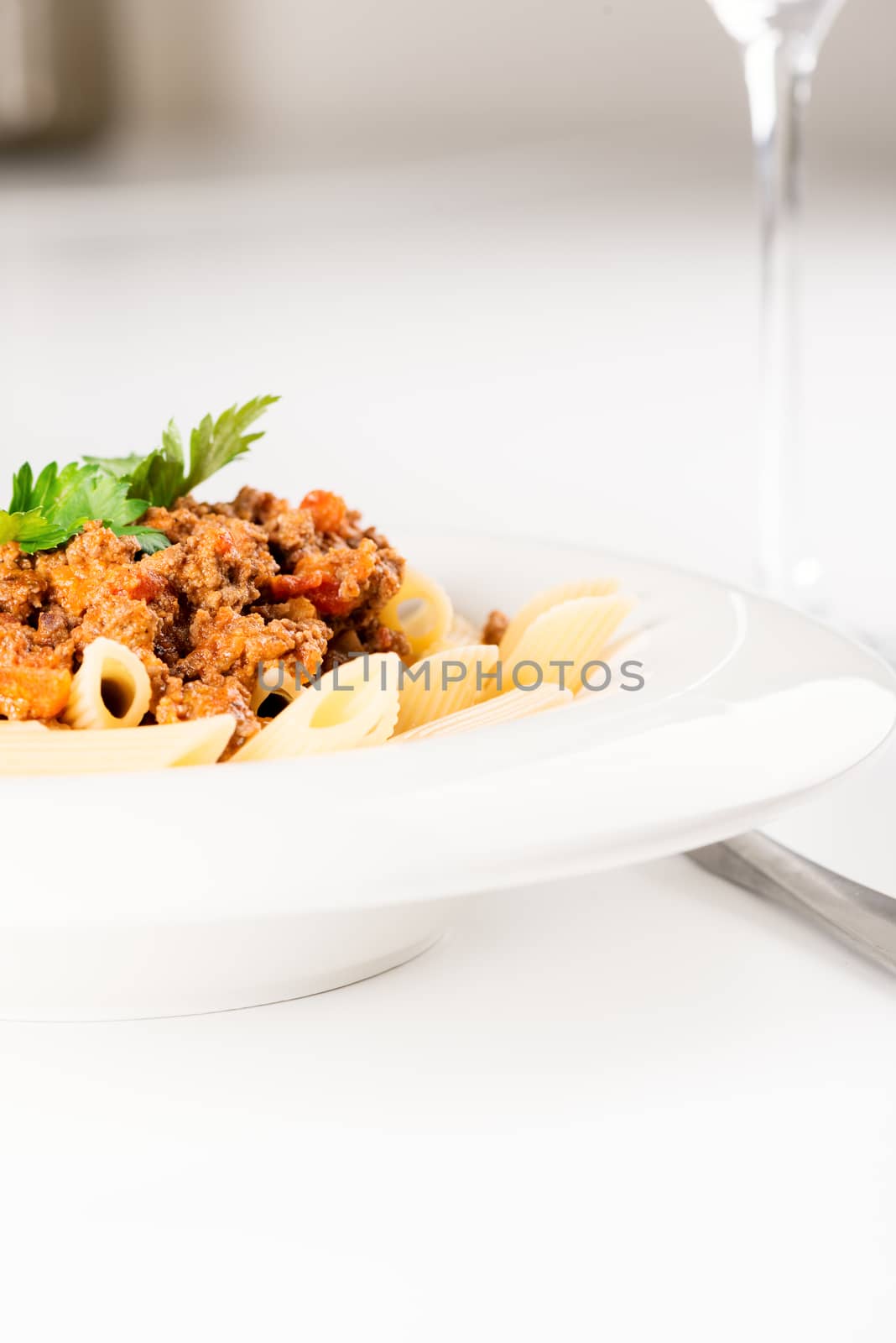 Penne Pasta with Bolognese Sauce vertical by Nanisimova