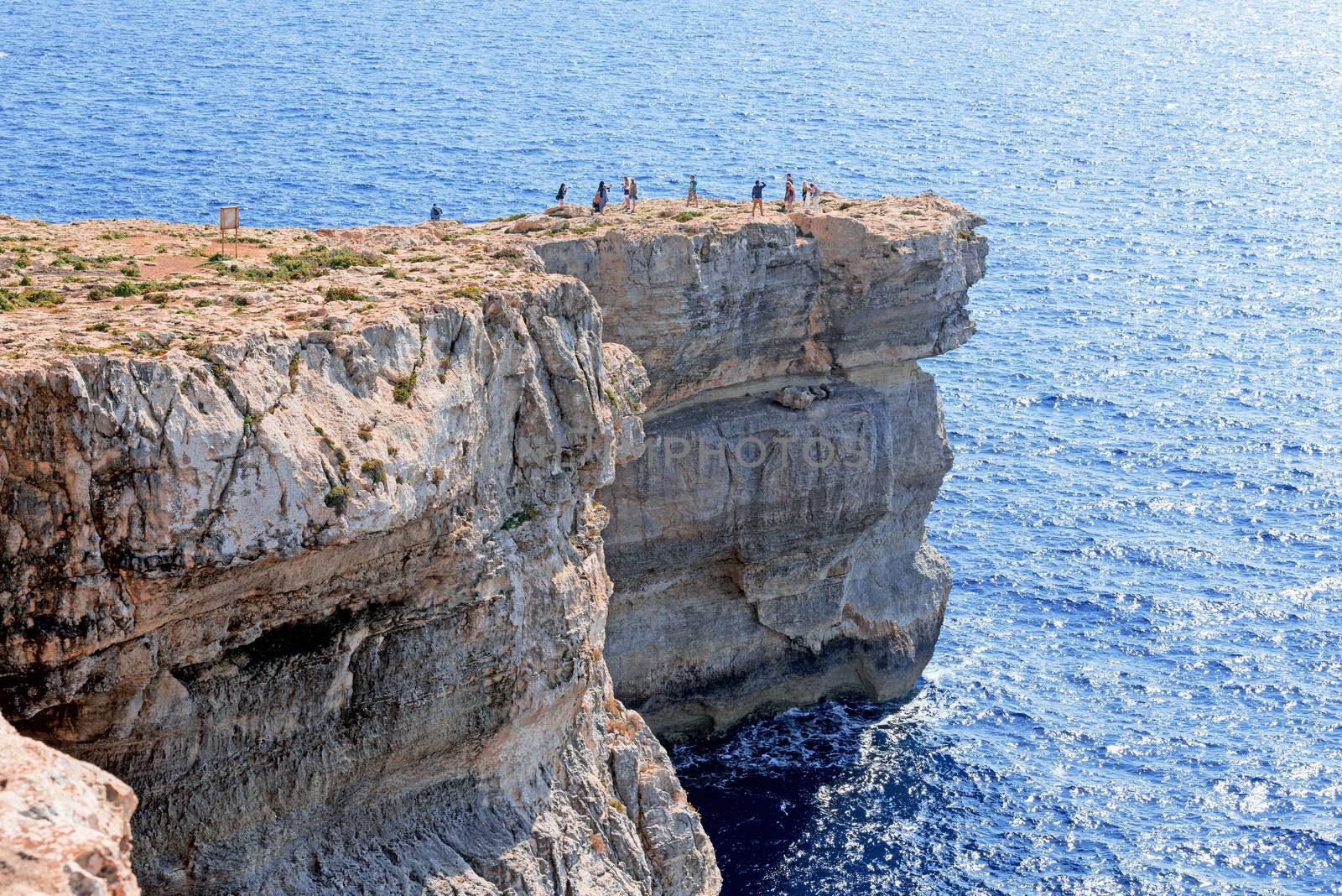 Azure Window in Gozo island with tourists by Nanisimova