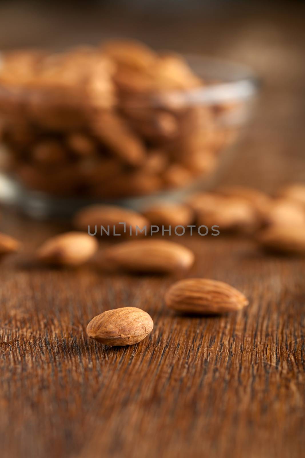 Macro closeup of some almonds in raw form unroasted and unsalted.  Shallow depth of field.