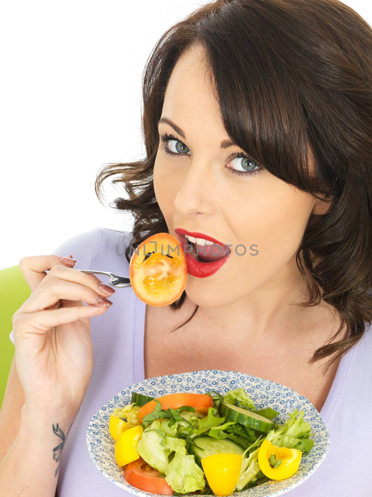 Young Woman Eating a Healthy Mixed Salad by Whiteboxmedia