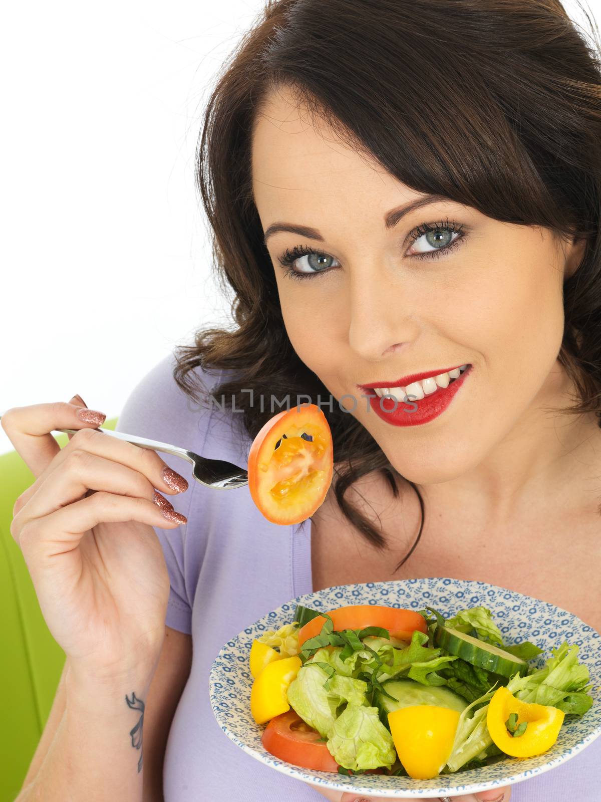 Young Attractive Woman Eating a Healthy Mixed Salad