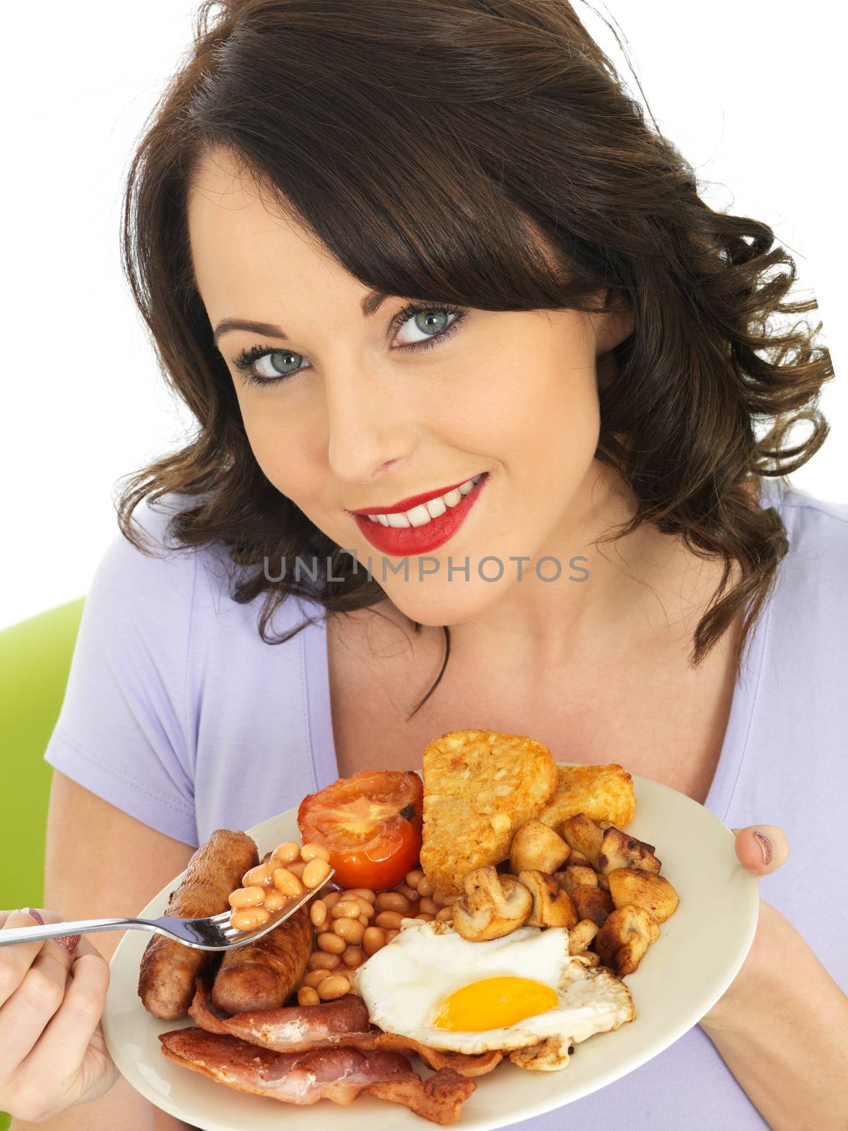 Young Woman Eating a Full English Breakfast by Whiteboxmedia