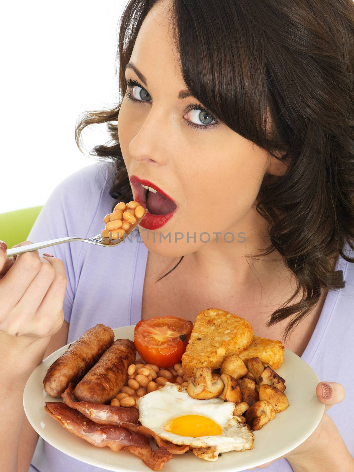 Young Attractive Woman Eating a Full English Breakfast