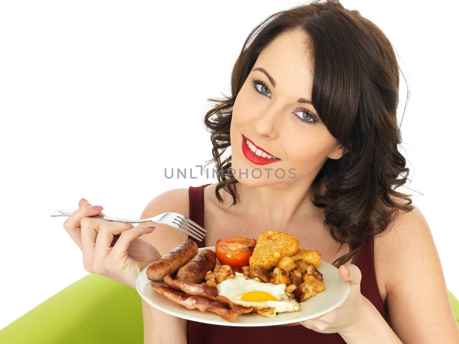 Young Attractive Woman Eating a Full English Breakfast