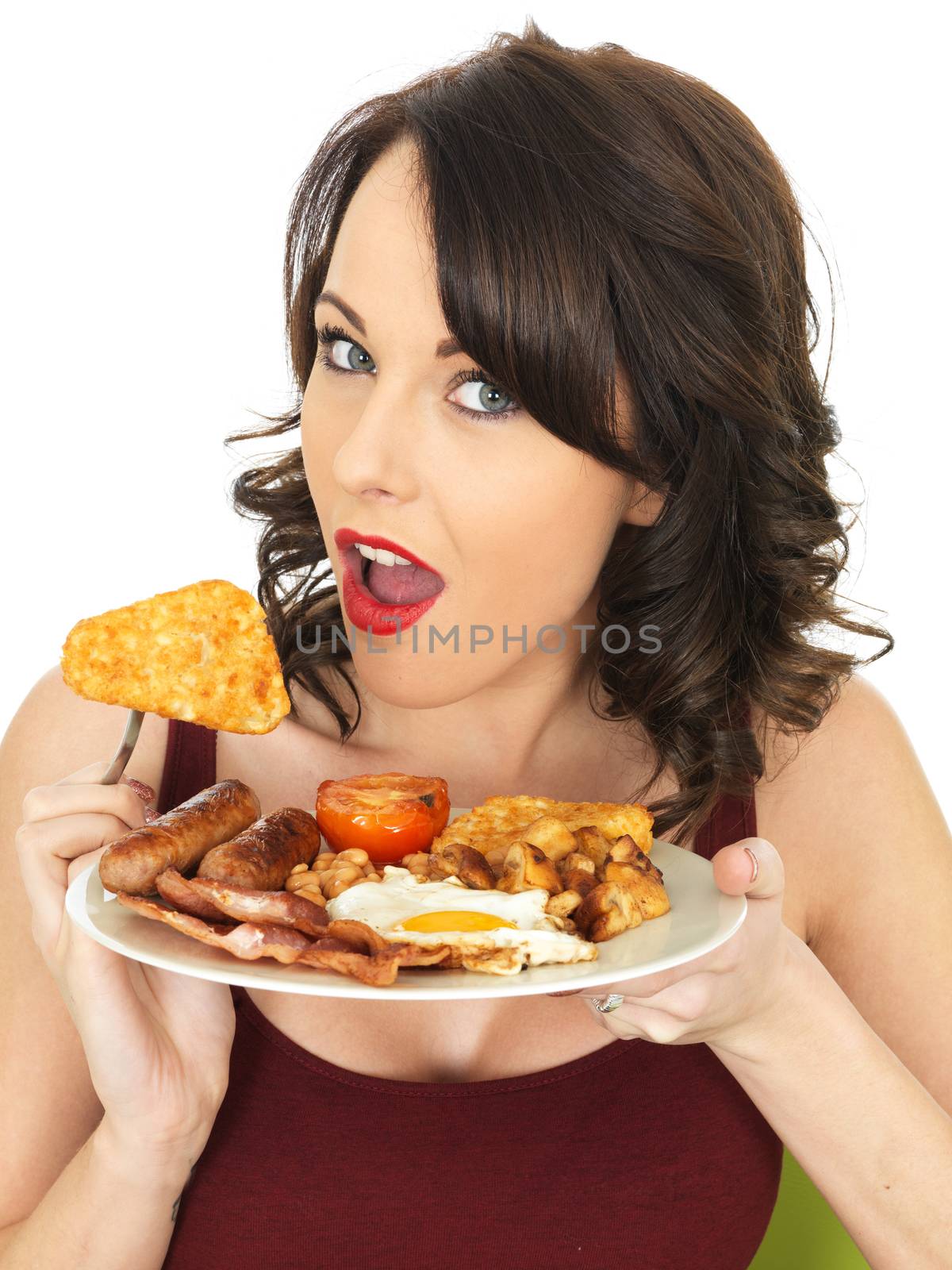 Young Attractive Woman Eating a Full English Breakfast