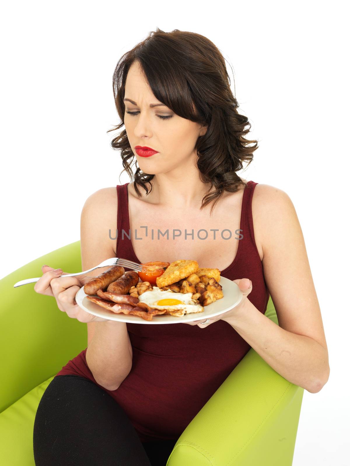 Young Attractive Woman Eating a Full English Breakfast