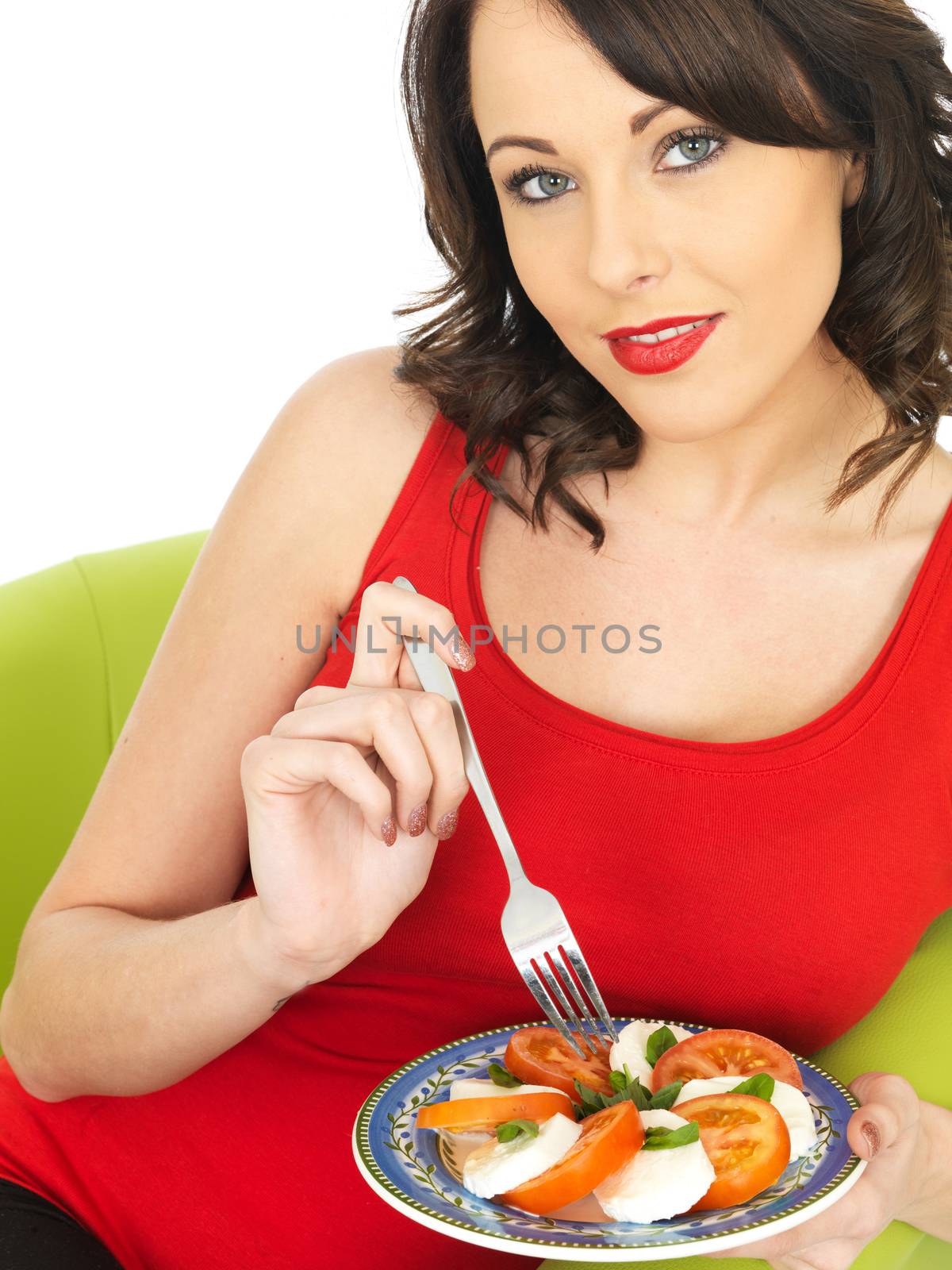 Young Woman Eating a Mozzarella Cheese and Tomato Salad by Whiteboxmedia