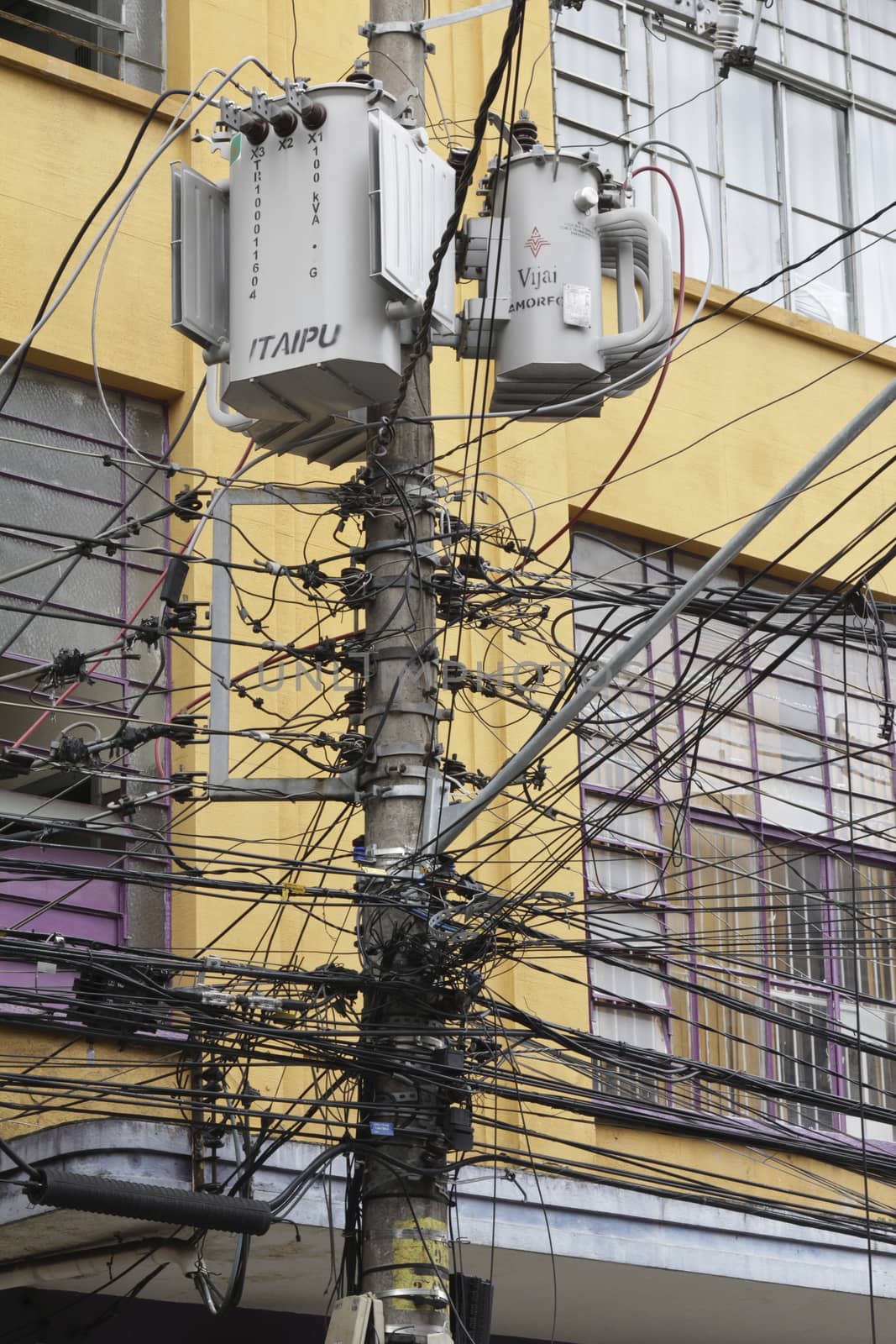 Tangle of Electrical Wires on Power Pole