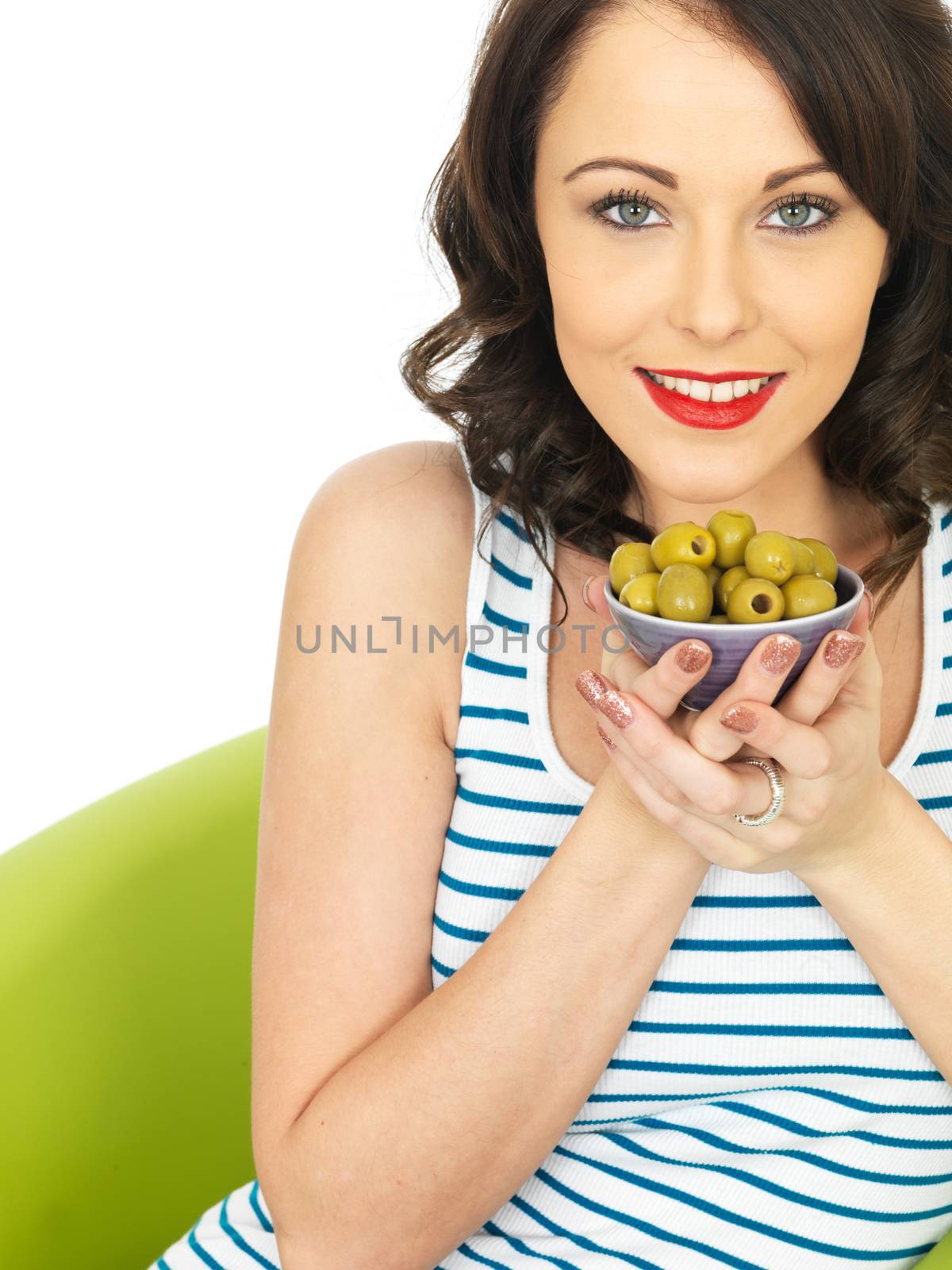 Young Healthy Woman Eating Green Olives