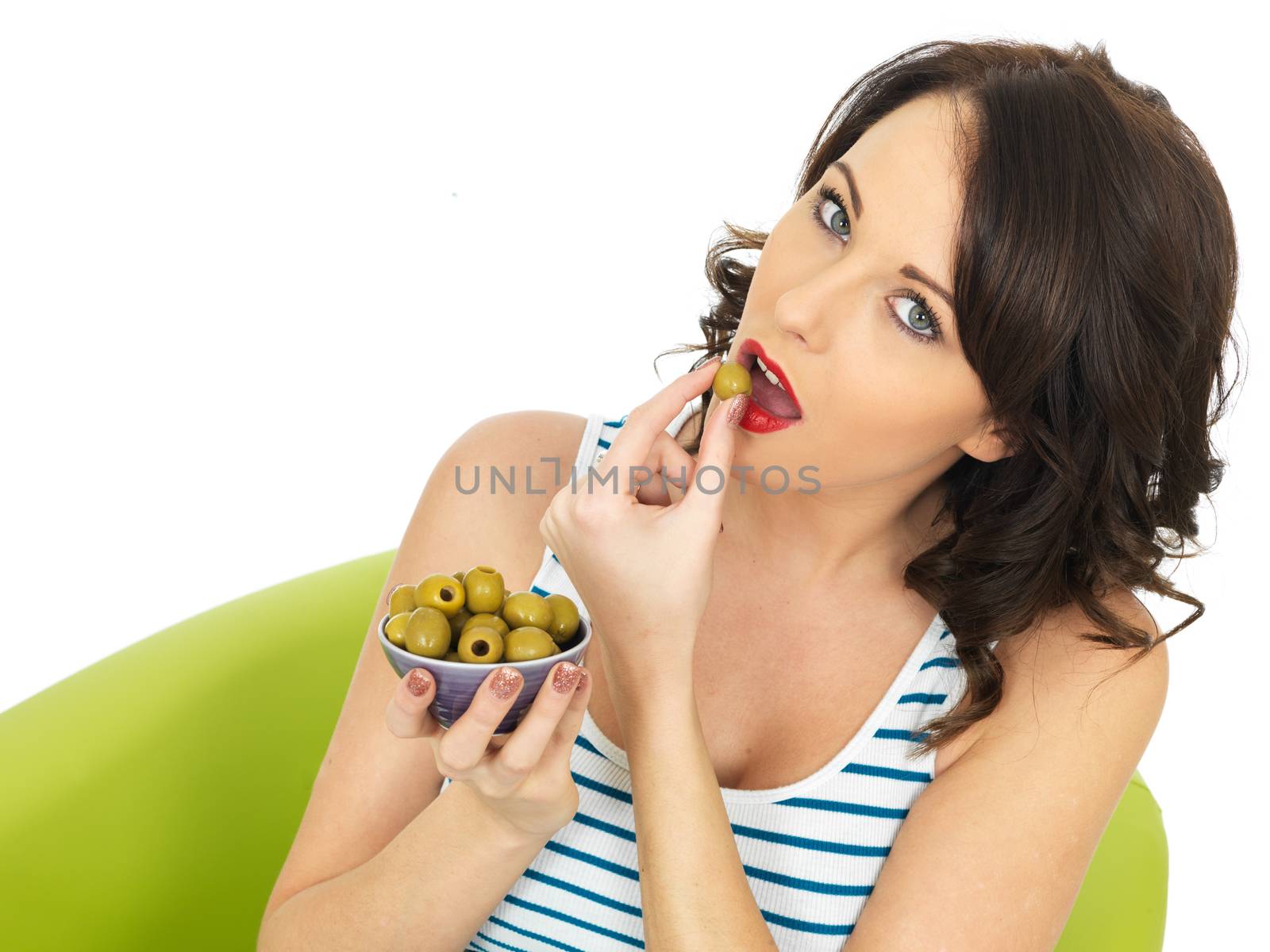 Young Healthy Woman Eating Green Olives