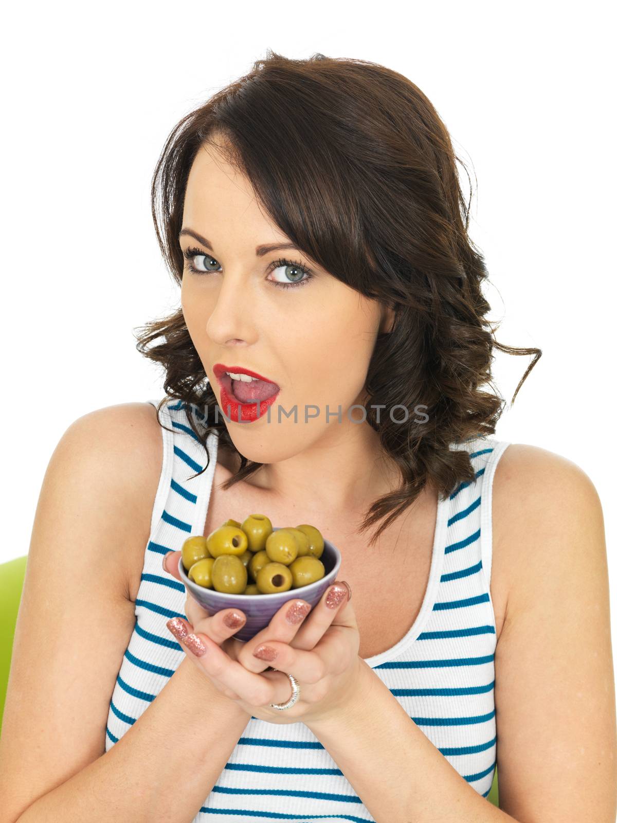 Young Healthy Woman Eating Green Olives