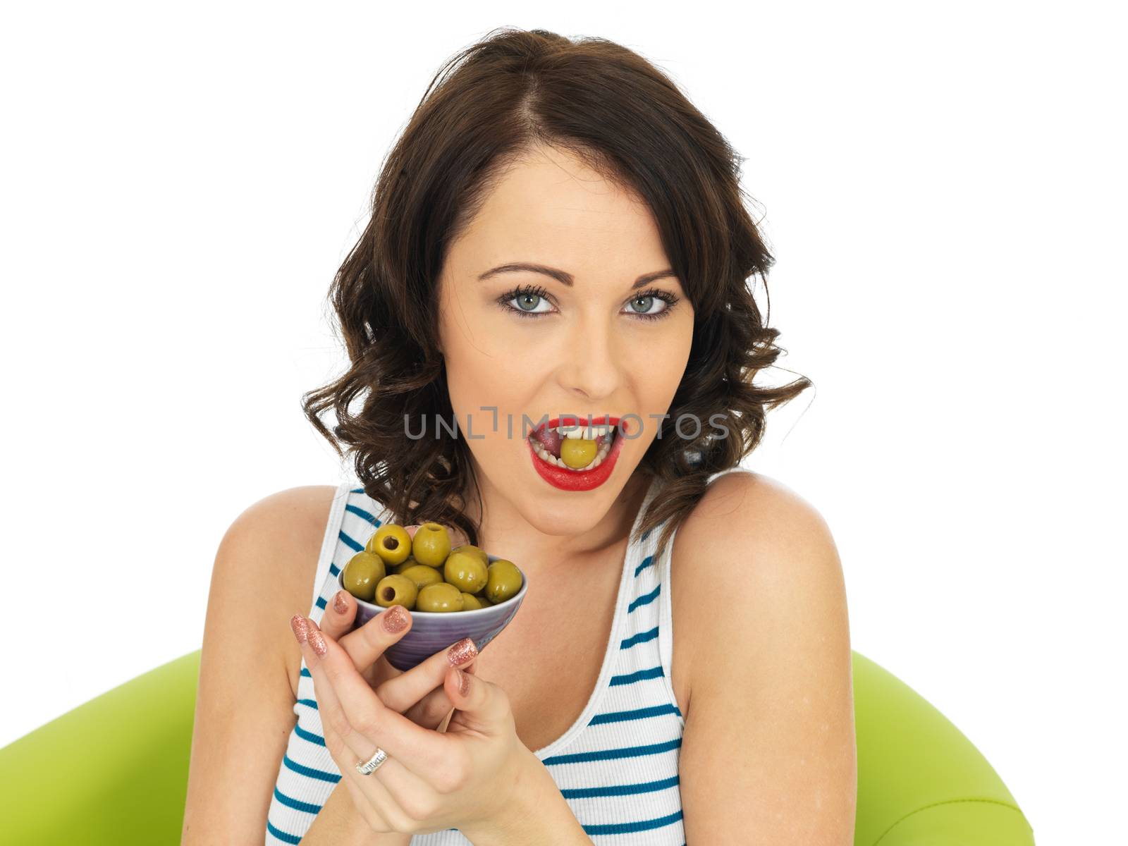 Young Healthy Woman Eating Green Olives