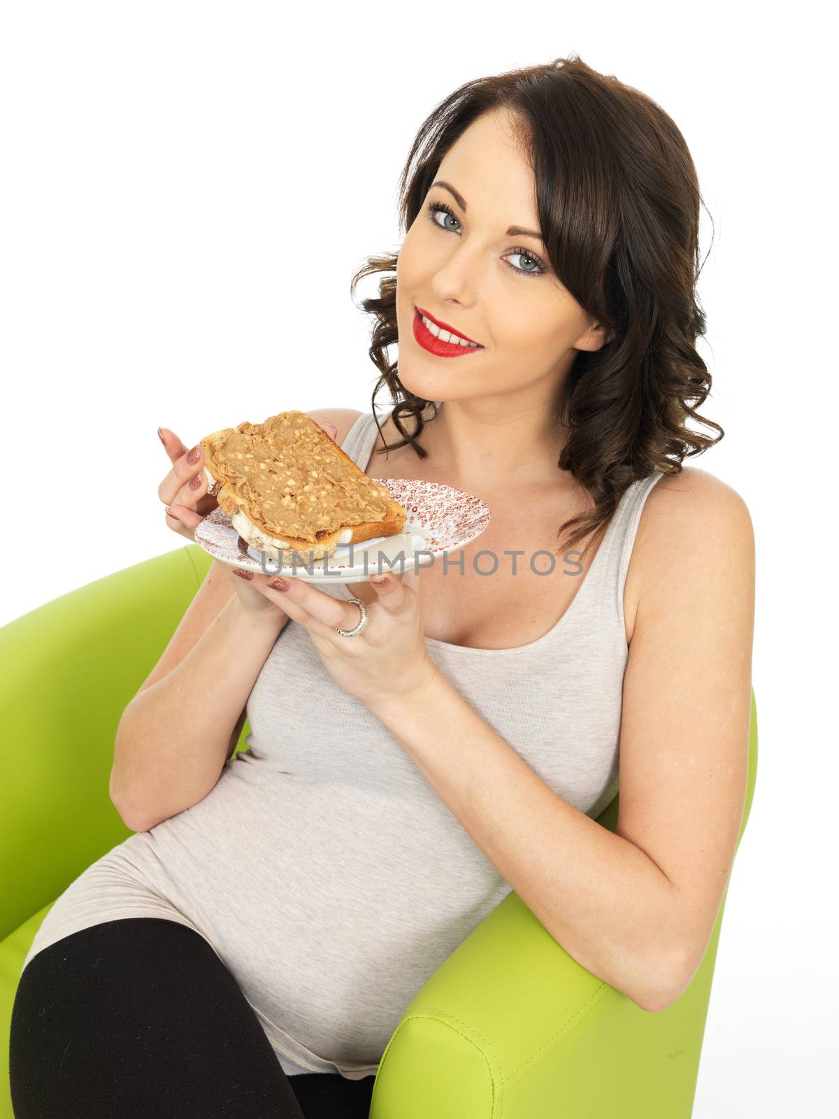 Young Woman Holding Toast with Crunchy Peanut Butter by Whiteboxmedia