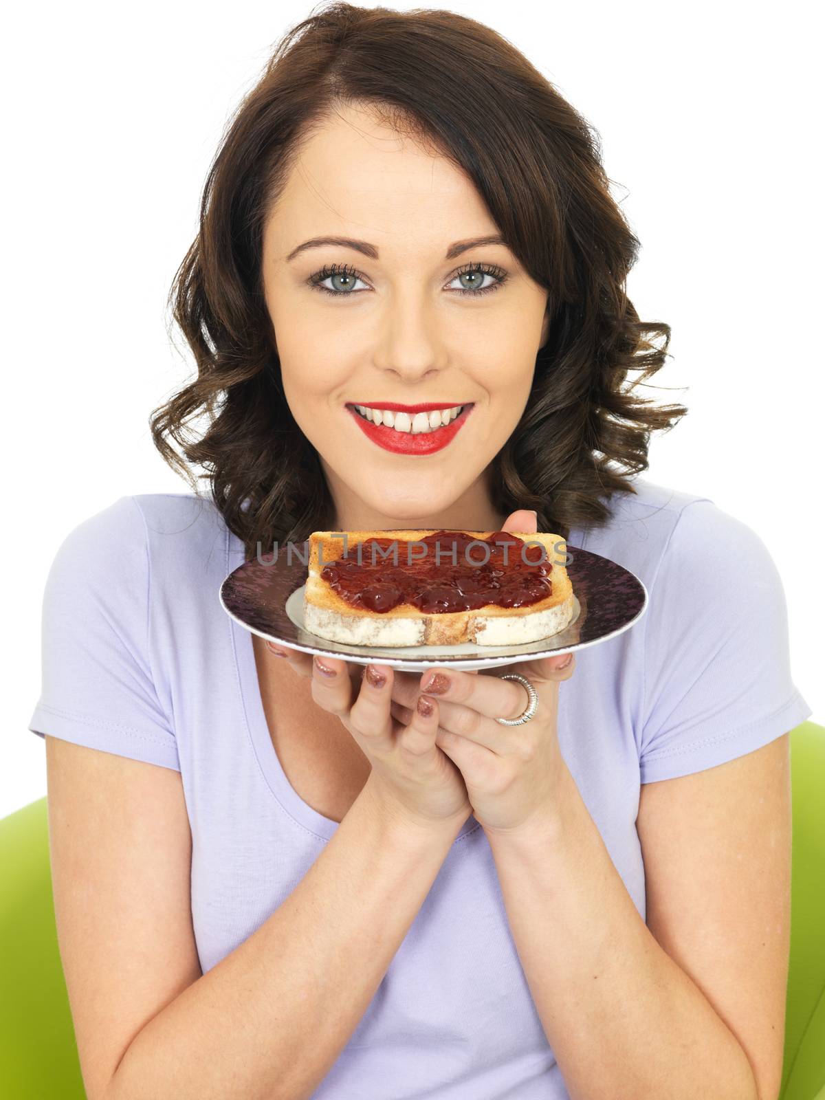 Young Woman With Strawberry Jam on Toast by Whiteboxmedia