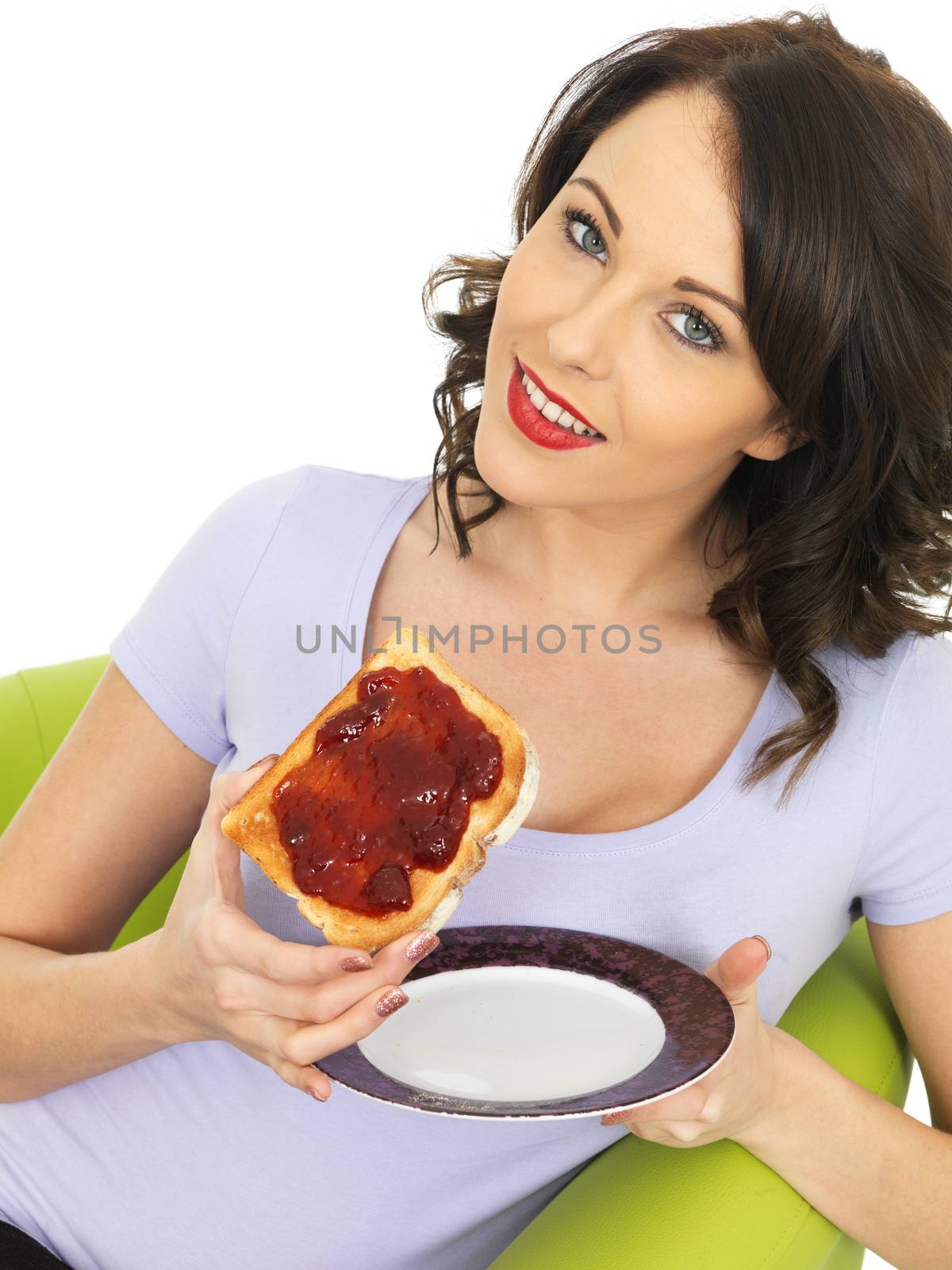 Healthy Young Woman With Strawberry Jam on Toast