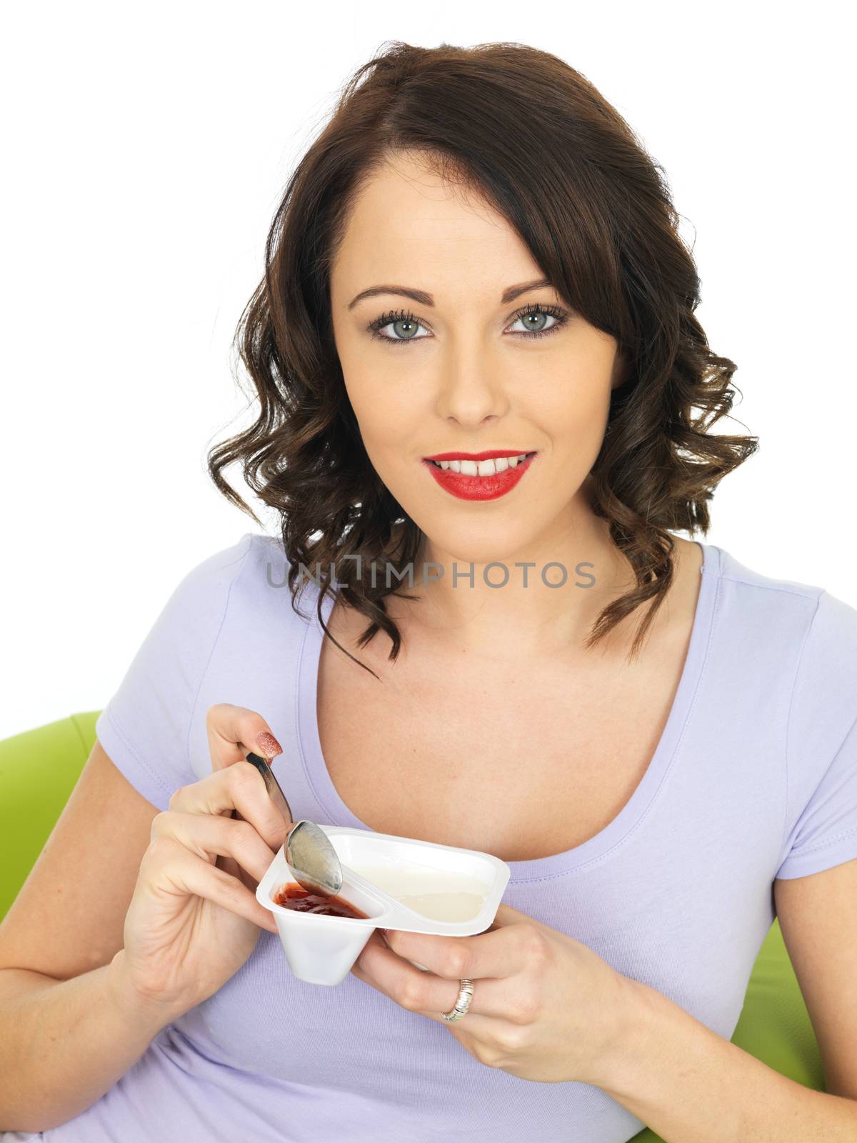 Healthy Attractive Young Woman Eating a Yogurt