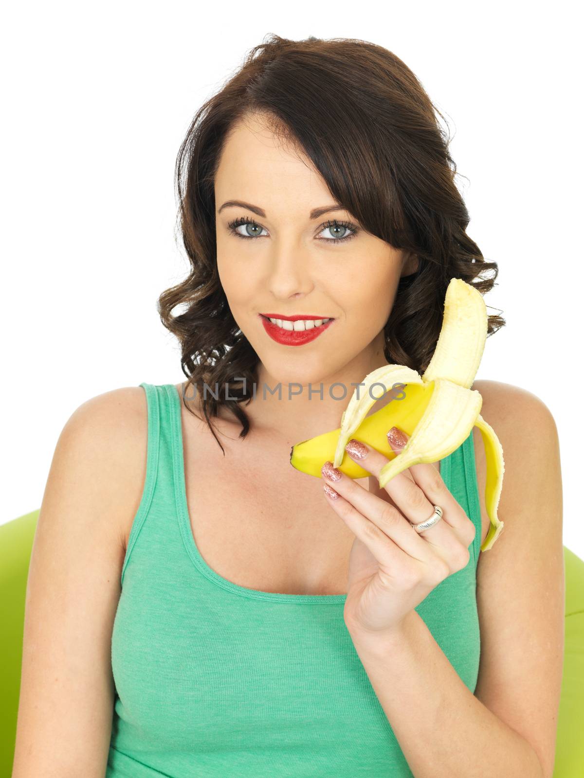 Young Woman Eating a Banana by Whiteboxmedia