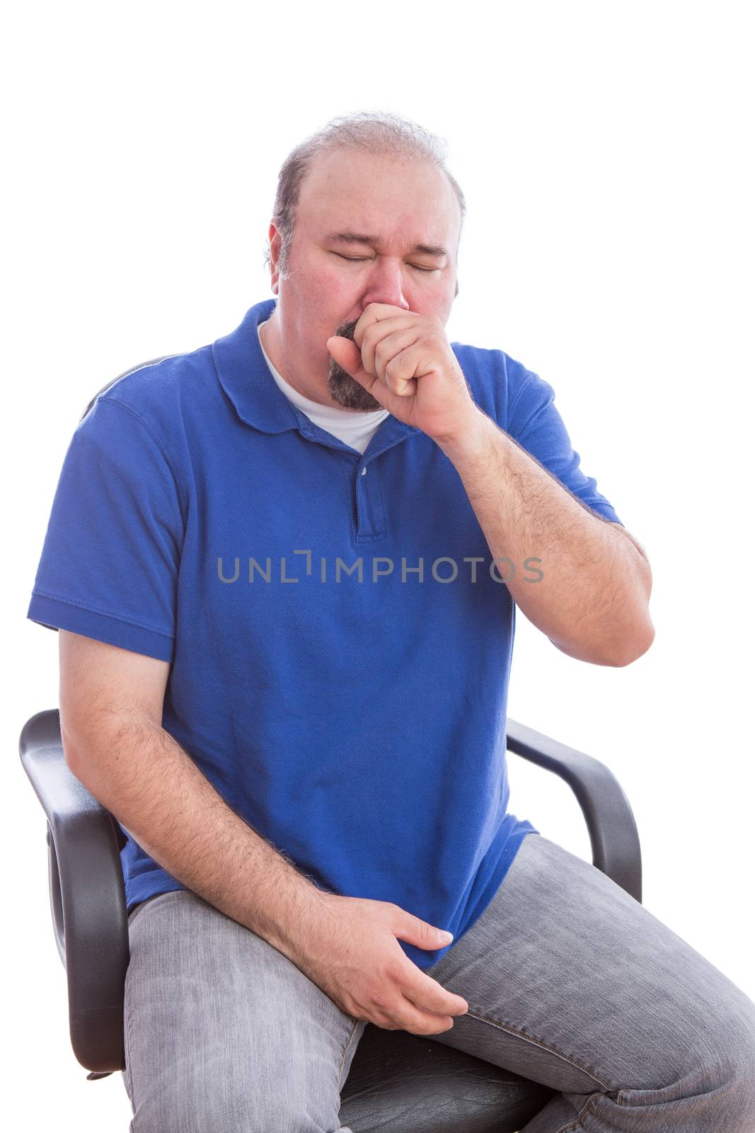 Close up Sick Bearded Man in Blue Shirt Sitting on a Single Chair Suffering From Cough. Isolated on White Background.