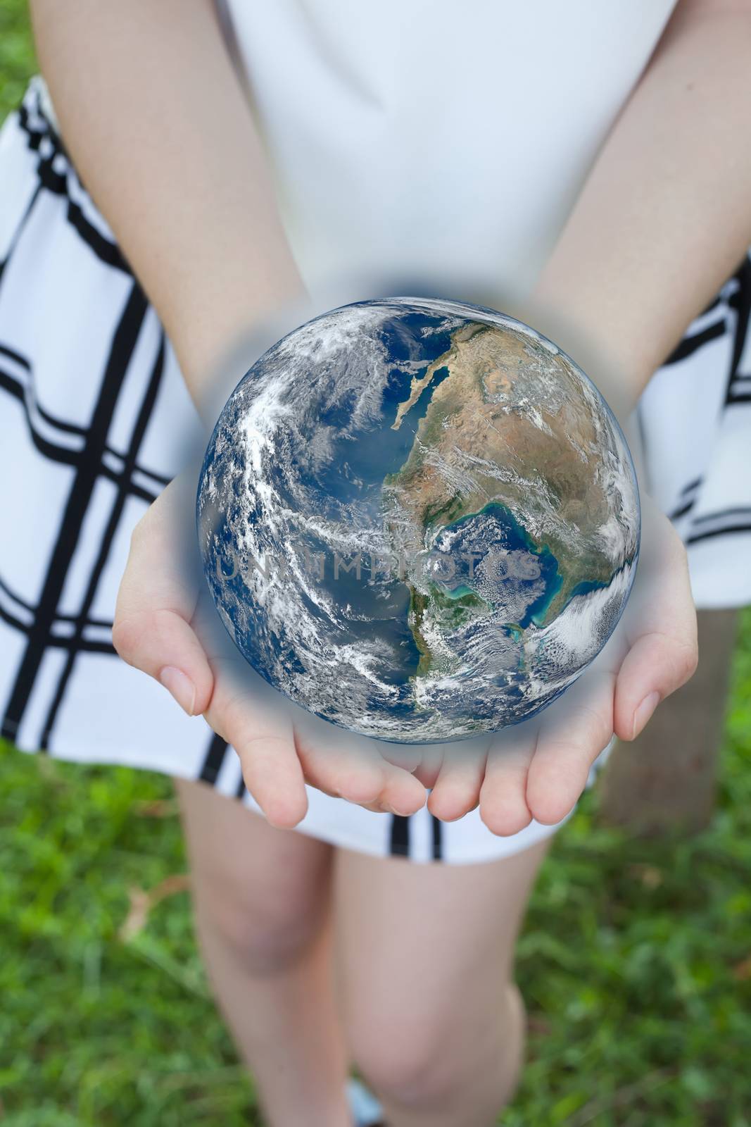 holding a glowing earth globe in hand.Elements of this image 
are furnished by NASA