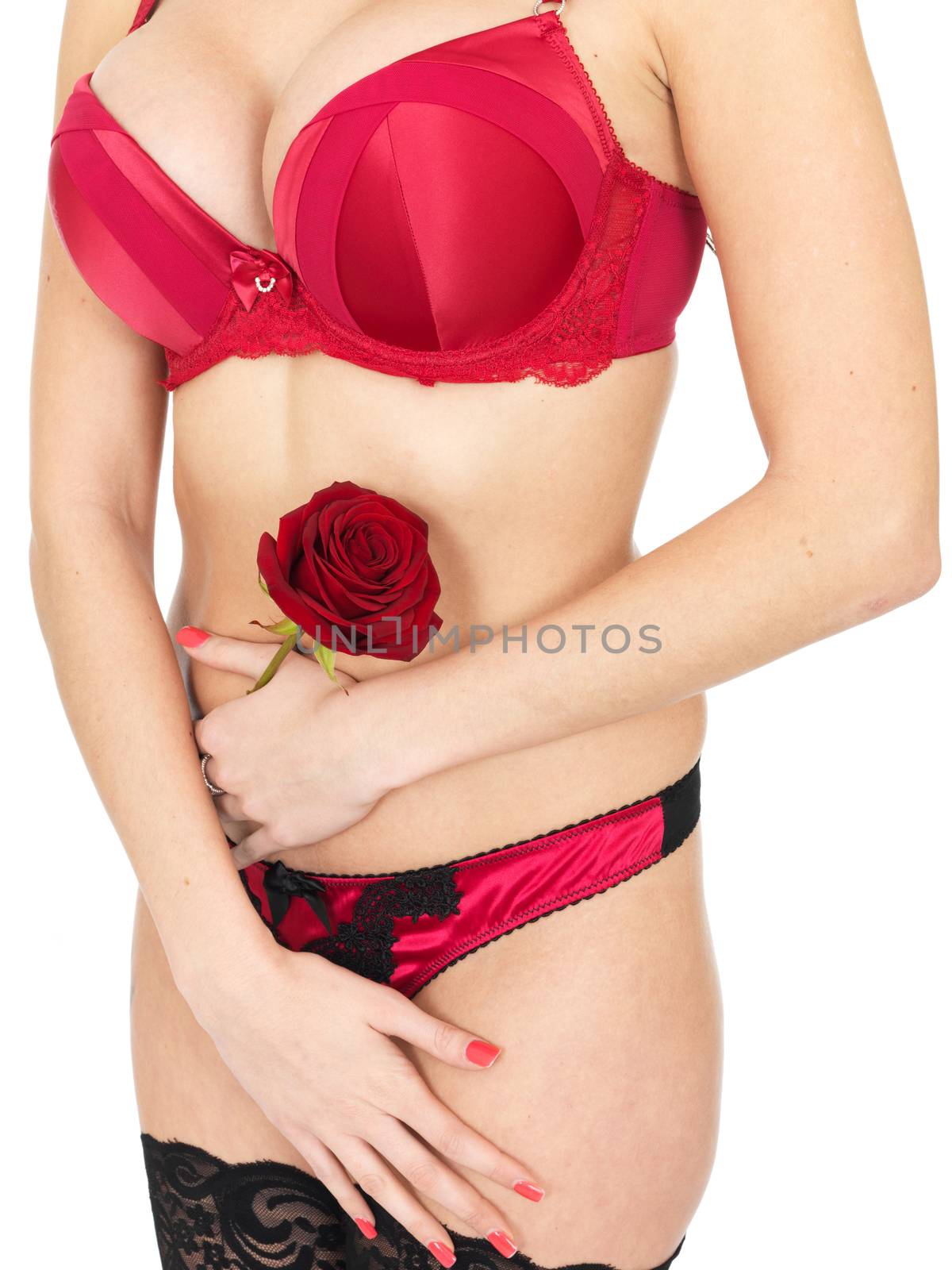 Sexy Young Woman Wearing Red Lingerie and Holding Red Roses by Whiteboxmedia