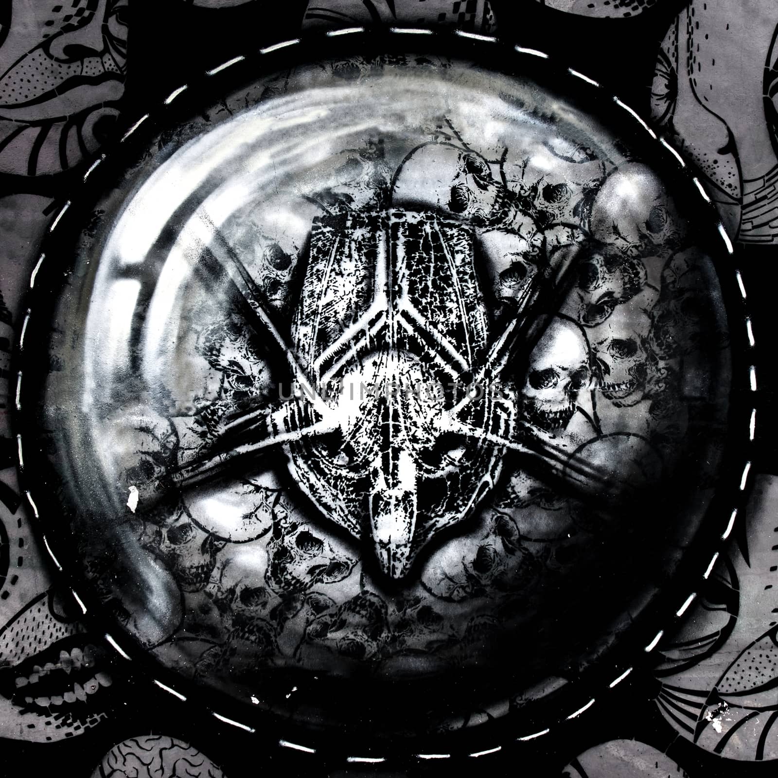 Closeup of an evil dark amulet in dark