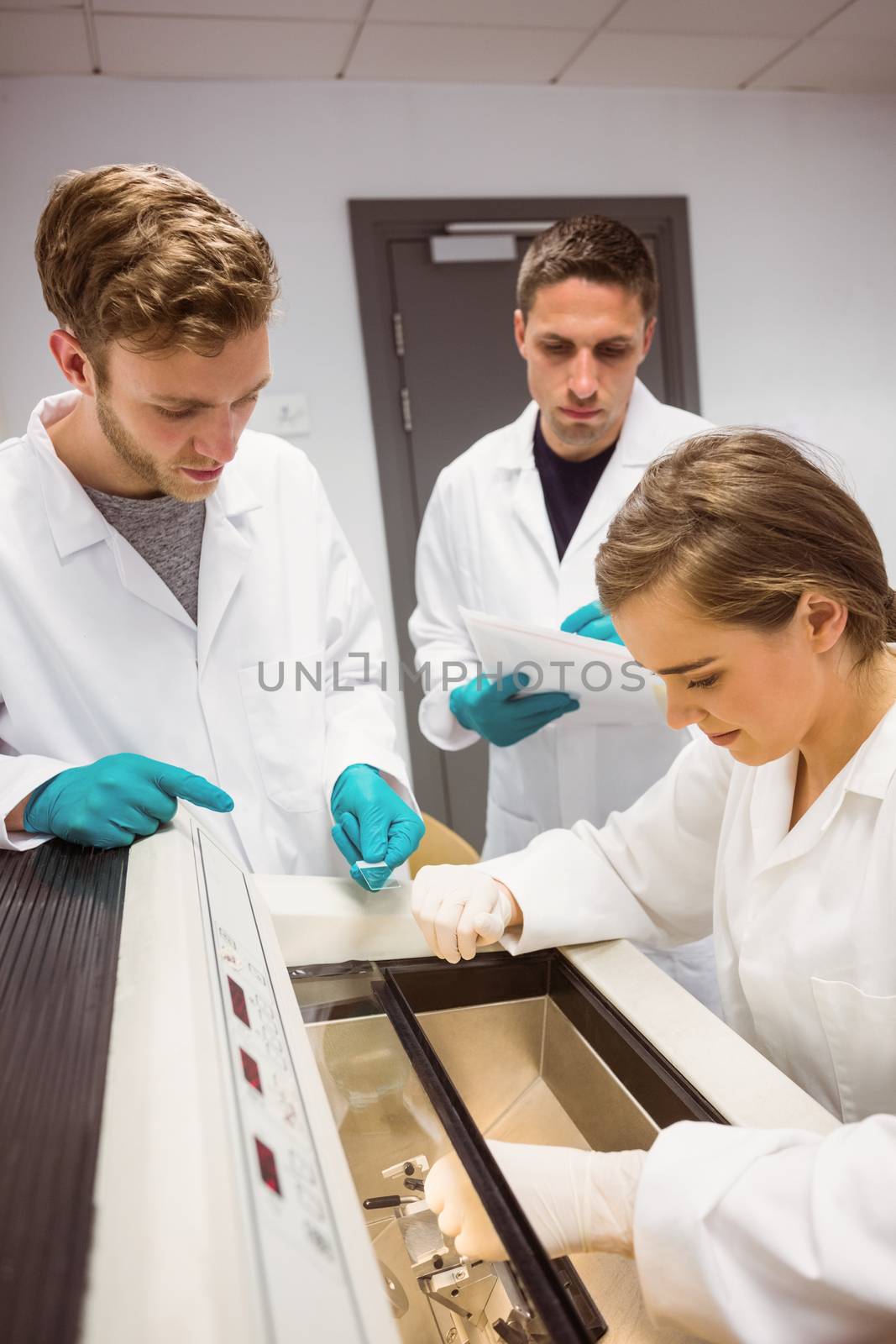 Science students using incubator in the lab by Wavebreakmedia